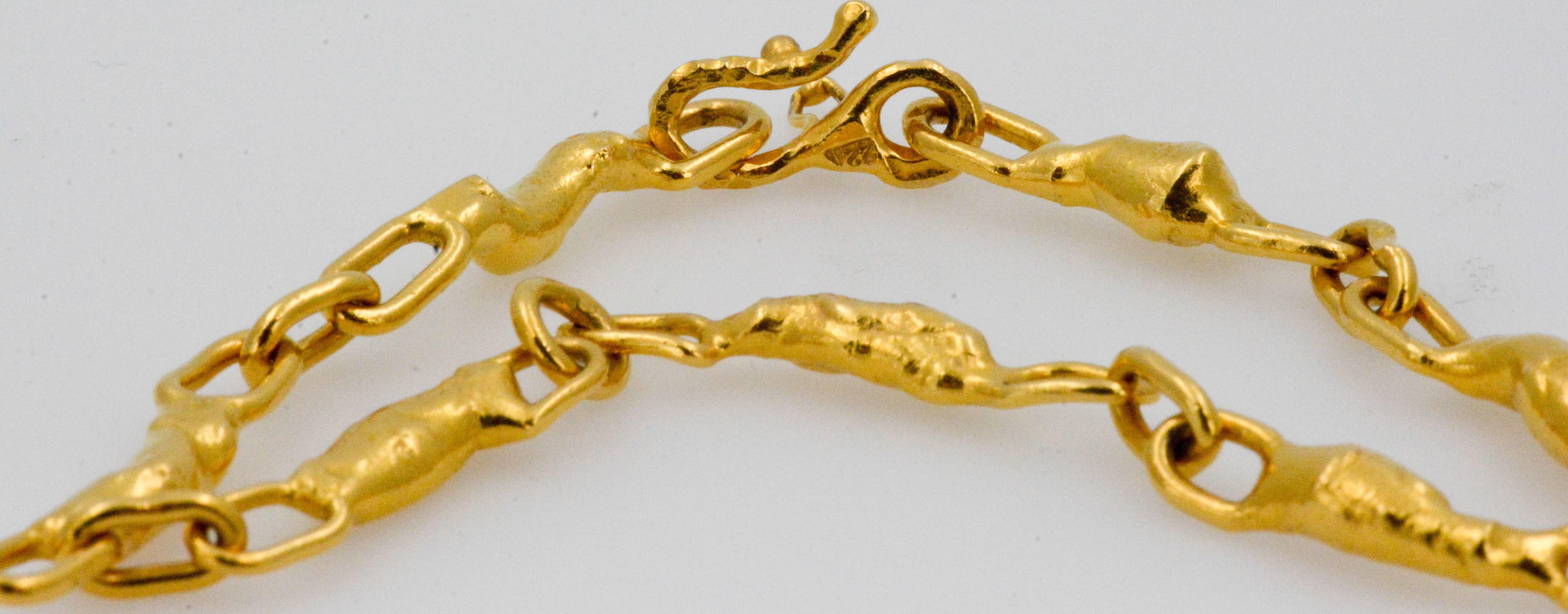 Almost brighter than the sun, this 22 karat yellow gold bracelet will brighten up your life! This bracelet is another captivating creation by designer, Jean Mahie, which is unique, one-of-a-kind, a true work of art. Solid 22 karat gold links