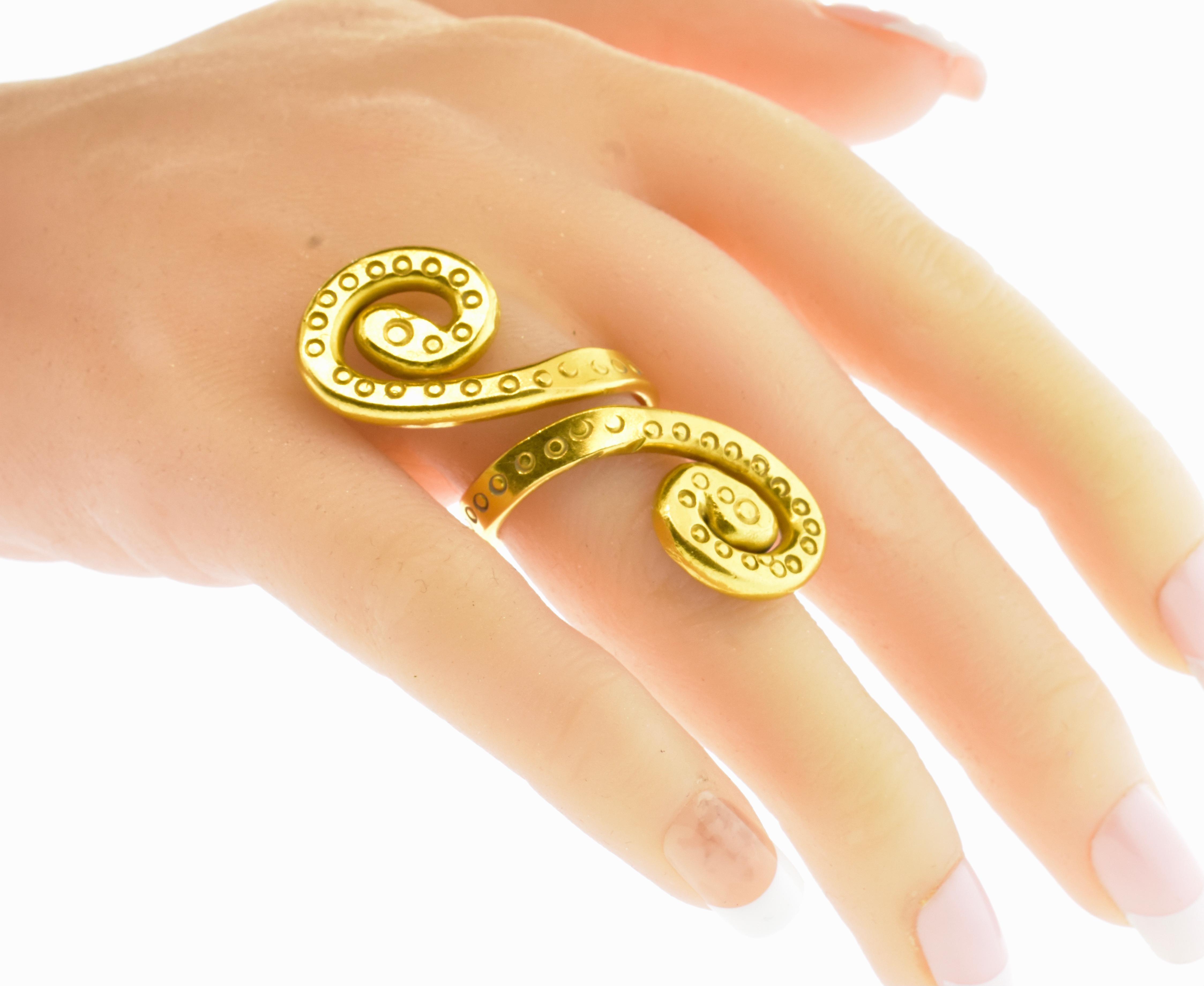 Jean Mahie yellow gold heavy one of a kind ring with a double snake motif.  Just over 2 inches in length, this solid 22k ring weighs 35.7 grams and is in fine condition.   It is a size 8 and can be resized.  The ring is signed on the shank along