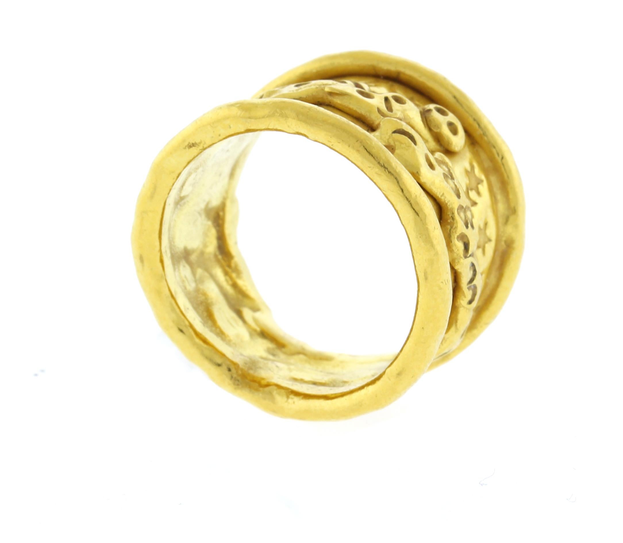 This exquisite 22kt  ring weighs 12.3 grams and is a size 5.5. It showcases a captivating dragon motif set against a celestial backdrop of dazzling stars, blending artistry with timeless elegance.

Jean Mahie jewelry is renowned for its bold,