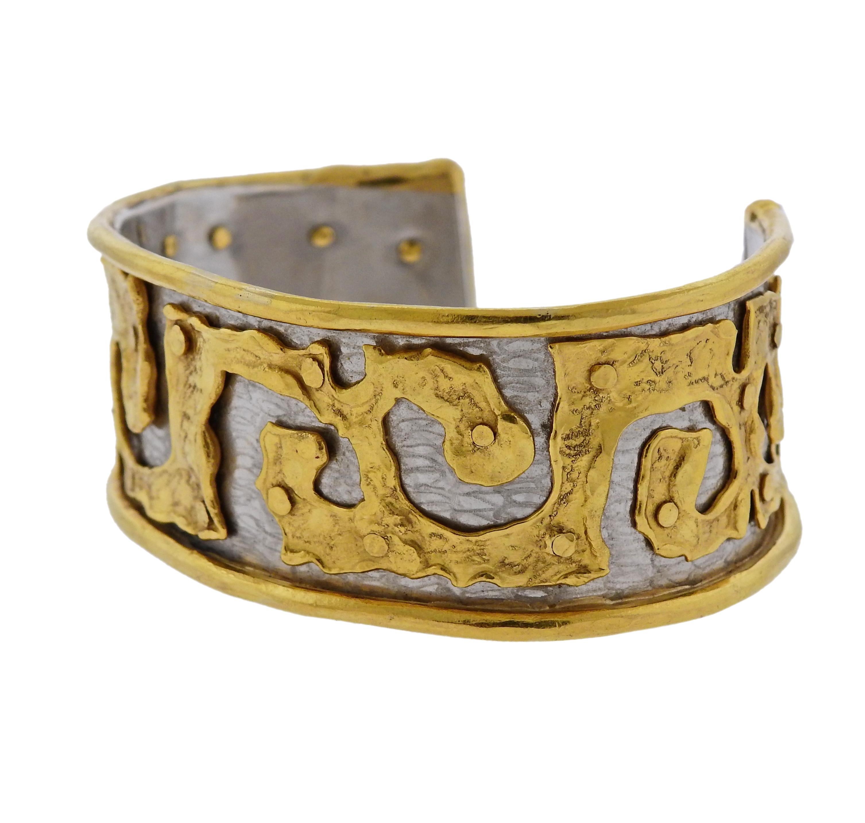 Impressive 22k gold and platinum cuff bracelet, designed by Jean Mahie. Bracelet will fit up to 8.5