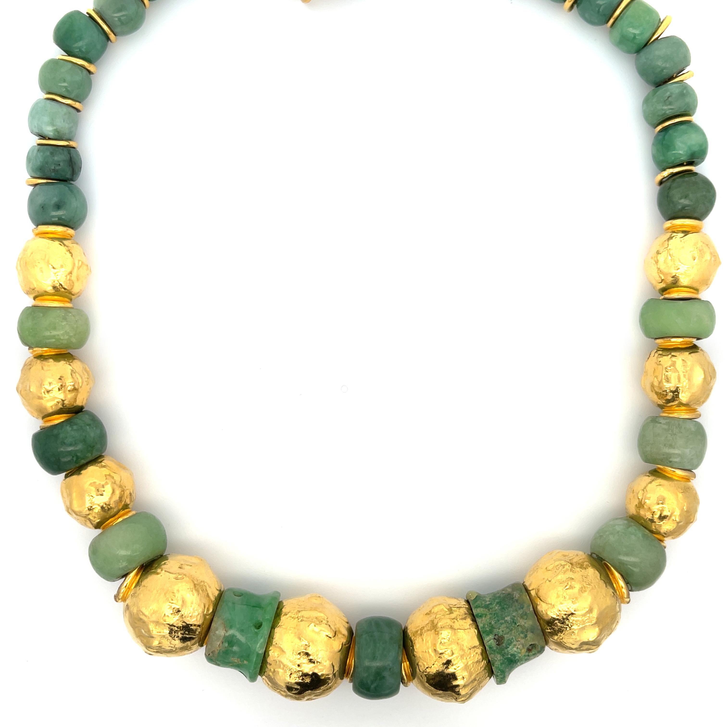 Jean Mahie Jade and 22K Gold Bead Necklace. The necklace features natural jadeite jade beads separated by 22k gold rings and large gold spheres. The jade beads are graduated from 8mm to 12mm, the gold spheres graduate from 15.40mm to 21.50mm. Length