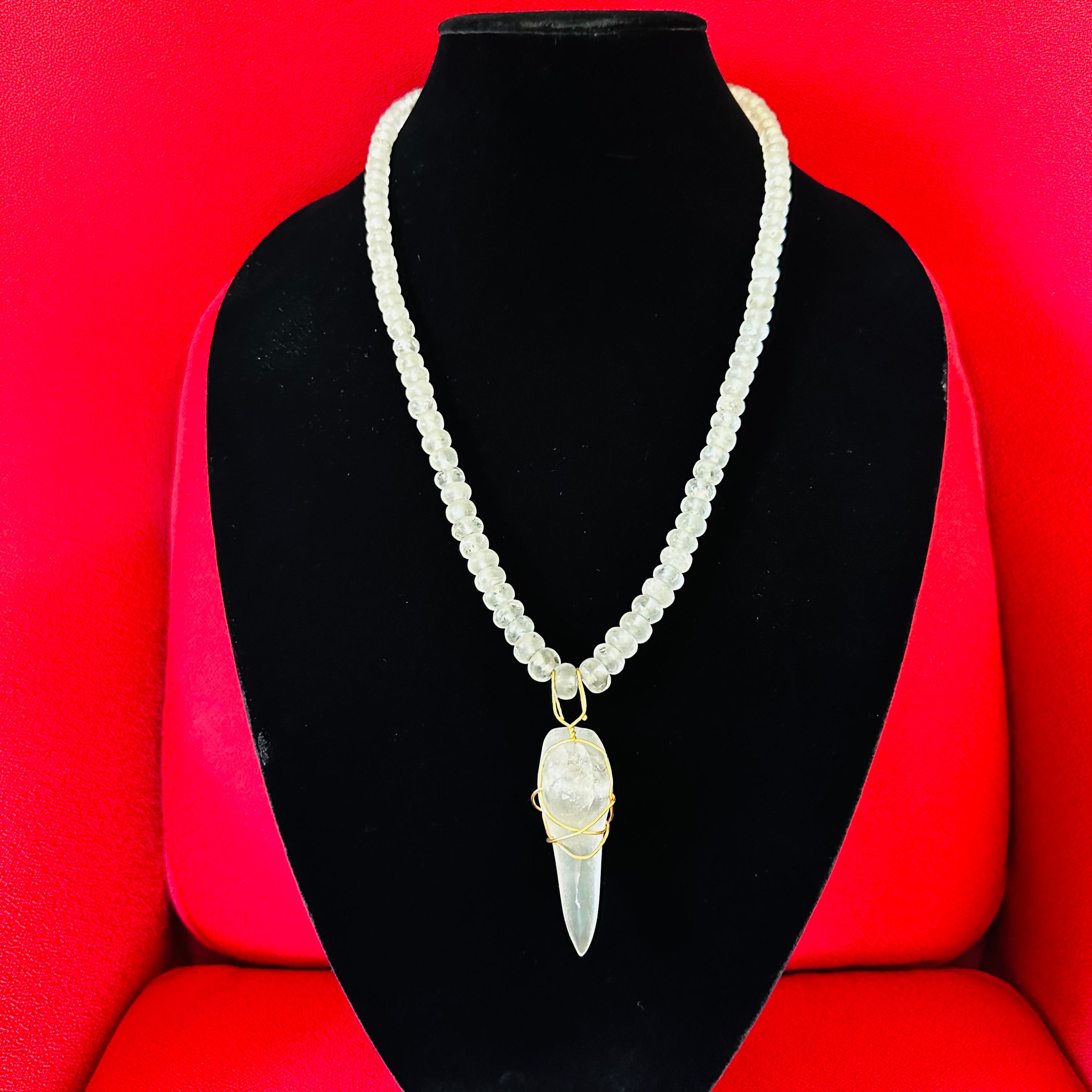 Jean Mahie Vintage Helenian ancient rock crystal beads Necklace with ancient Carved Birds Head Pendant with 22k Gold wire. 32 inches long strong on wire with 22 karat gene mahi clasp and 22 karat wrapped pendant. 