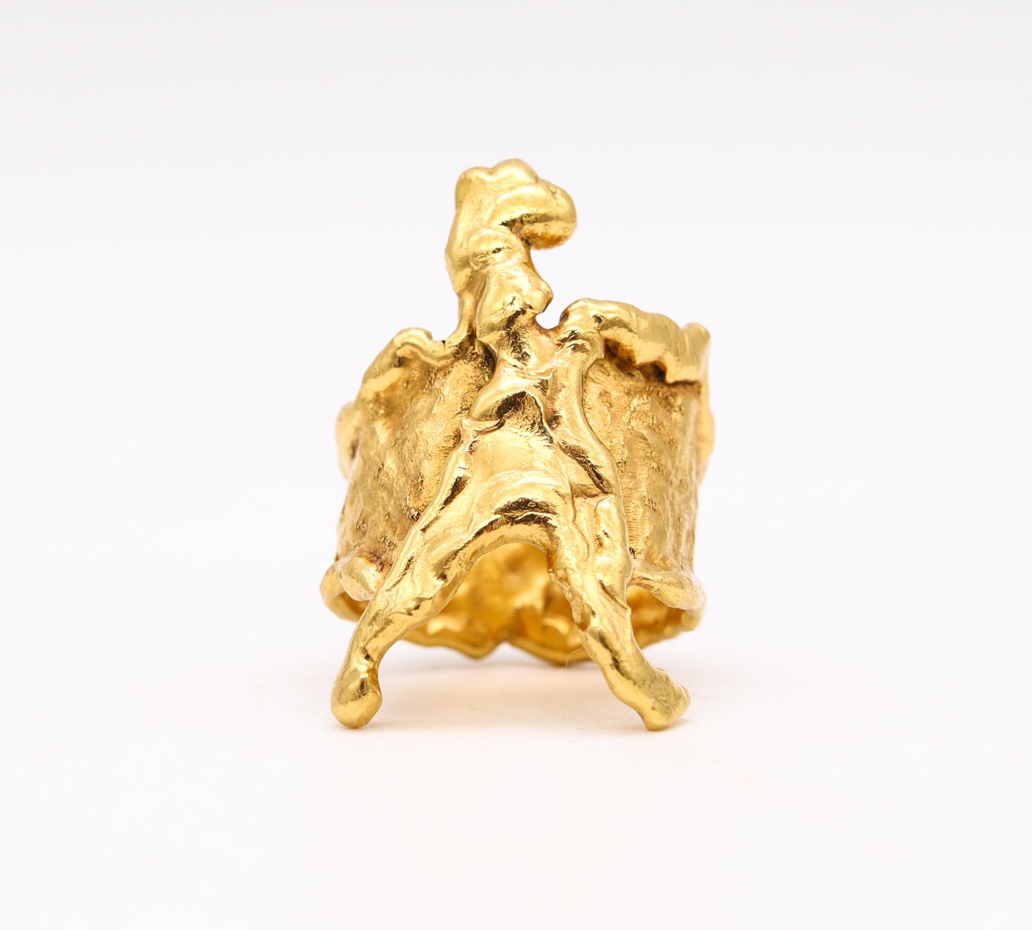 Cocktail ring designed by Jean Mahie.

An incredible piece of wearable art, created in Paris France by the artist and goldsmith Jean Mahie, back in the 1980. This little sculpture has been crafted in solid rich yellow gold of 22 karats with the