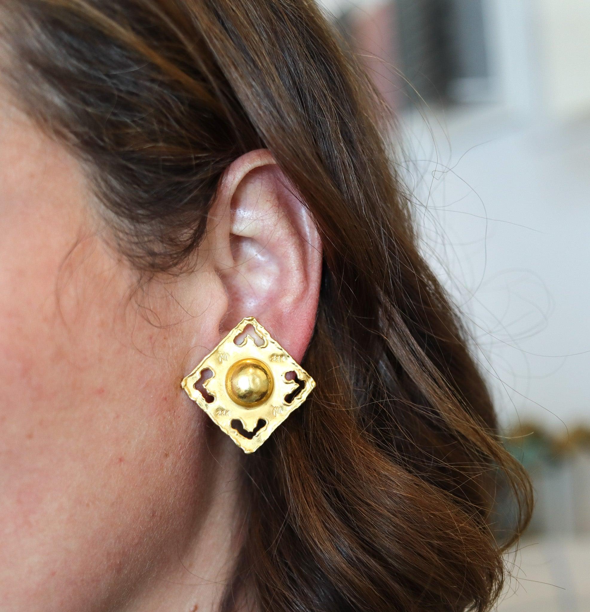 Square earrings designed by Jean Mahie.

These clips-on earrings types are a beautiful pieces of art, created in Paris France by the artist and goldsmith Jean Mahie, back in the late 1980. The pair of sculptural ear-clips has been crafted in solid