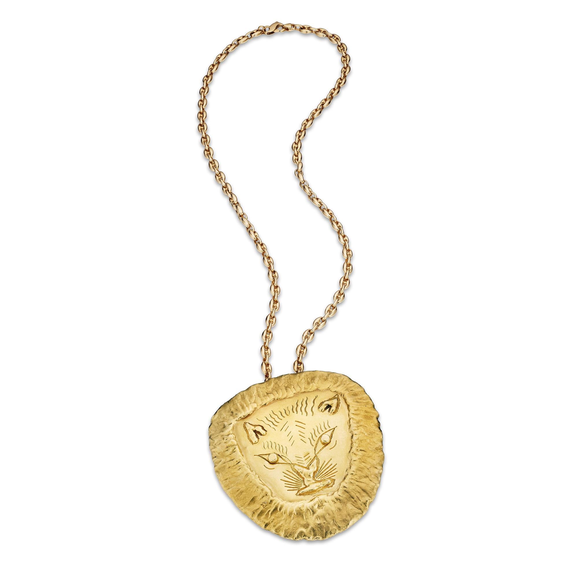 A powerful handmade one-of-a-kind Jean Mahie vintage pendant is destined for the lion hearted!  With a courageously crafted lion face, this vintage statement pendant is all strength.  Signed Jean Mahie.  22 karat yellow gold.  Circa 1980.  3 1/4