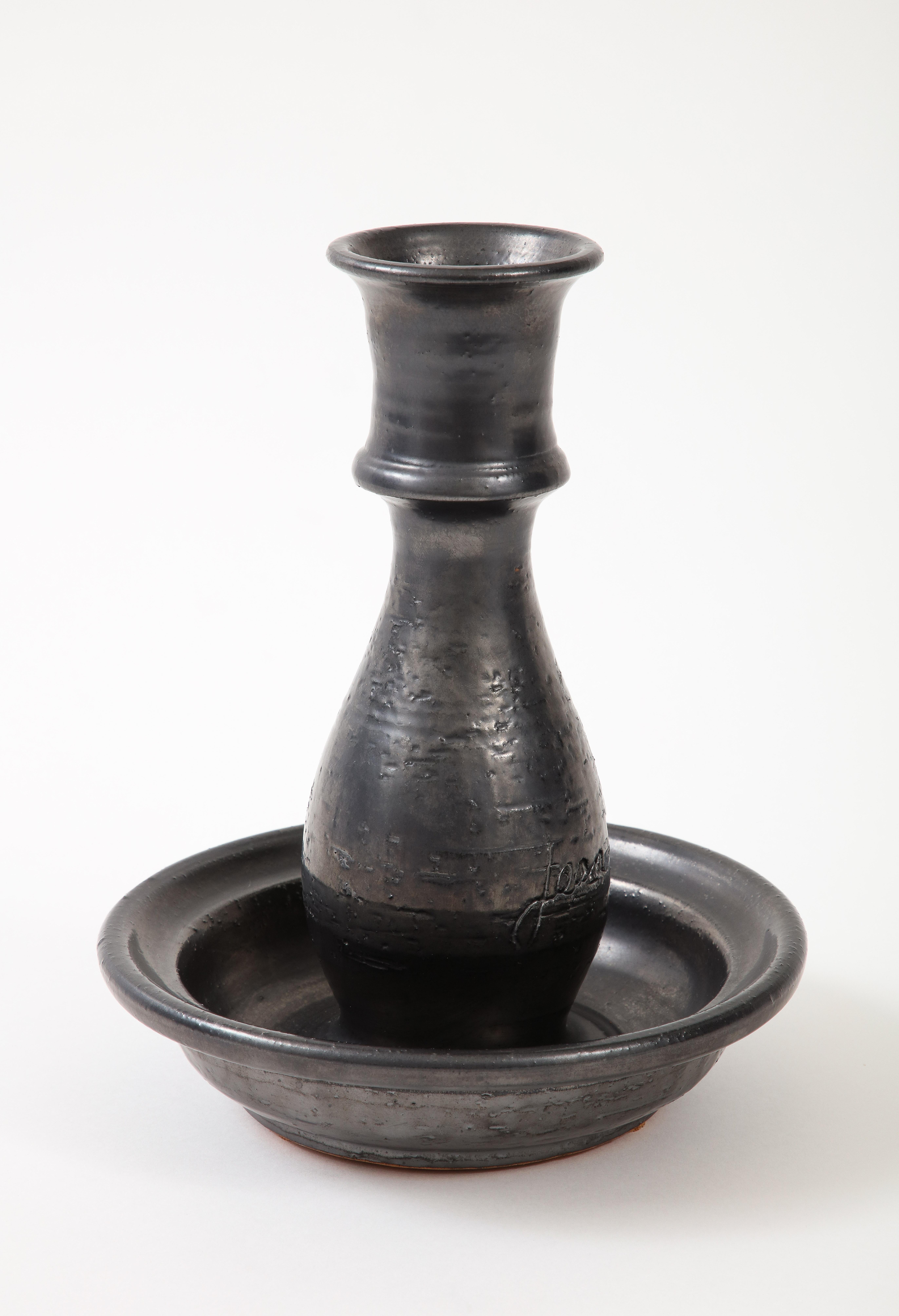 Jean Marais (1913-1998), Signed “Jean Marais’, France, c. 1950
candlestick, black enamel glaze, Vallauris red clay
Measures: height: 10, diameter 8.5 in.

Jean Marais was a French Movie Star, Heart-throb, and the Muse nad Boyfriend of Jean
