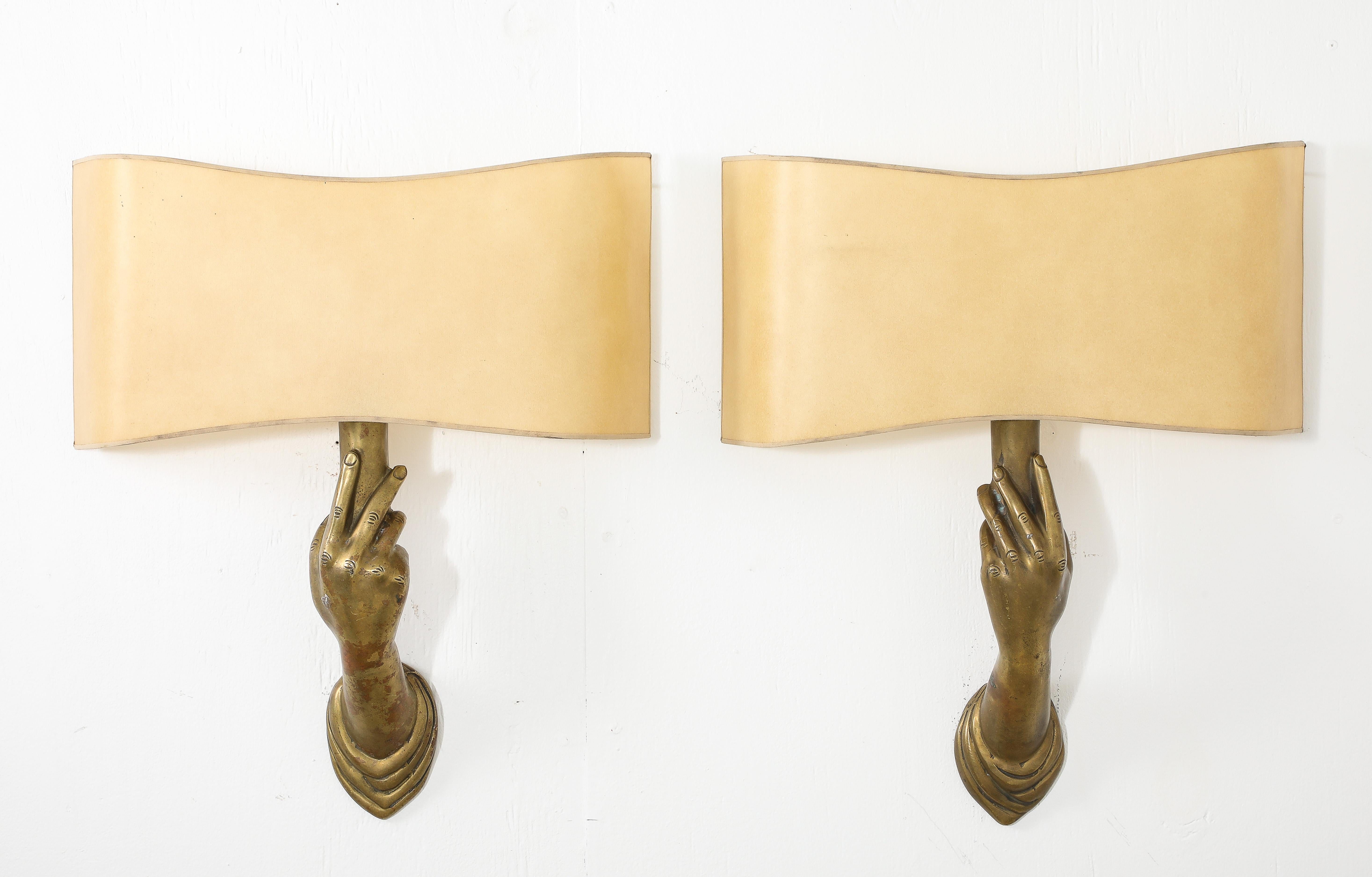A rare pair of hand sconces by Jean Marais, originally part of his ceramic line, this version in bronze is never seen. It is said the inspiration for the model came from his movie “Belle & La Bête” where lights thought the castle are held by real