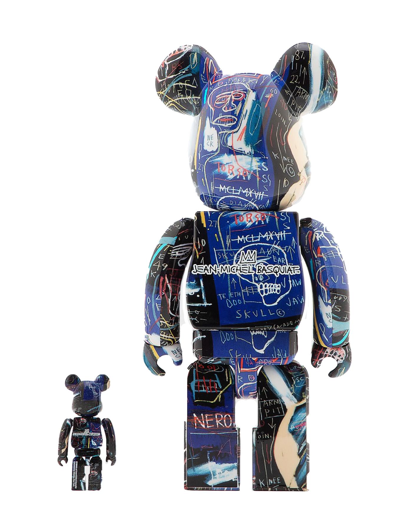Basquiat Bearbrick 400% Vinyl Figures Set of 2:
A unique Basquiat Bearbrick statue set trademarked & licensed by the Estate of Jean-Michel Basquiat. The partnered collectibles reveal licensed original iconic 1980s Basquiat imagery wrapping the