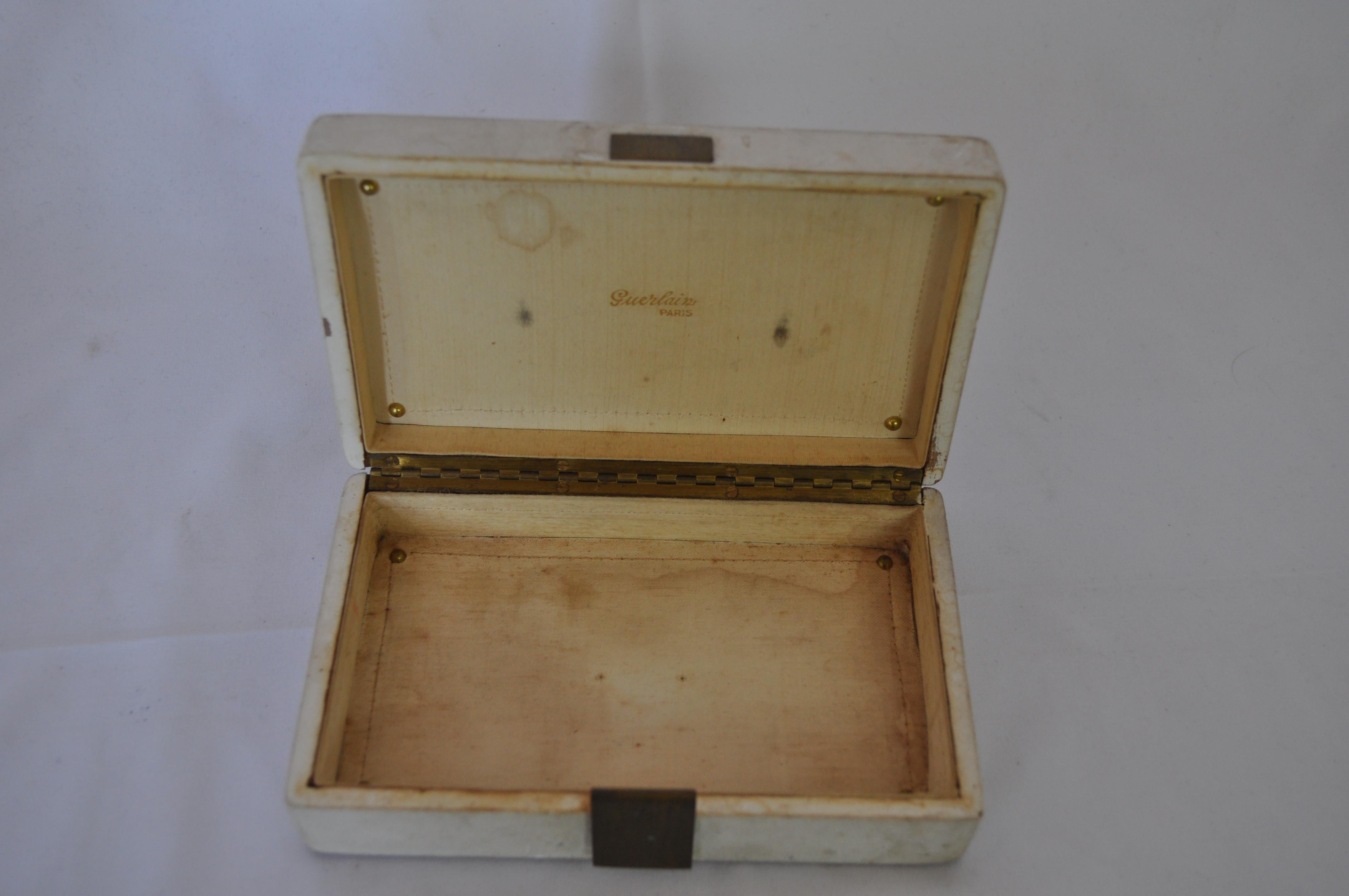 Rare and impressive perfume box designed by Jean Michel Franck for Gerlain in 1940. The box is made in poplar wood decorated with golden braces, surrounded by plaster and brass attach.