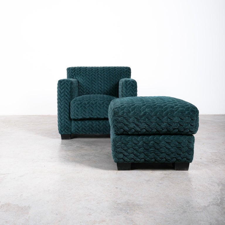 Armchair designed by Jean Michel Frank in 1932 with one matching ottoman, manufactured by Ecart, acquired in the showroom Jean-Michel Frank in the 1960 and re-upholstered with Rubelli Venezia green velvet fabric.

Great comfort chair and ottoman