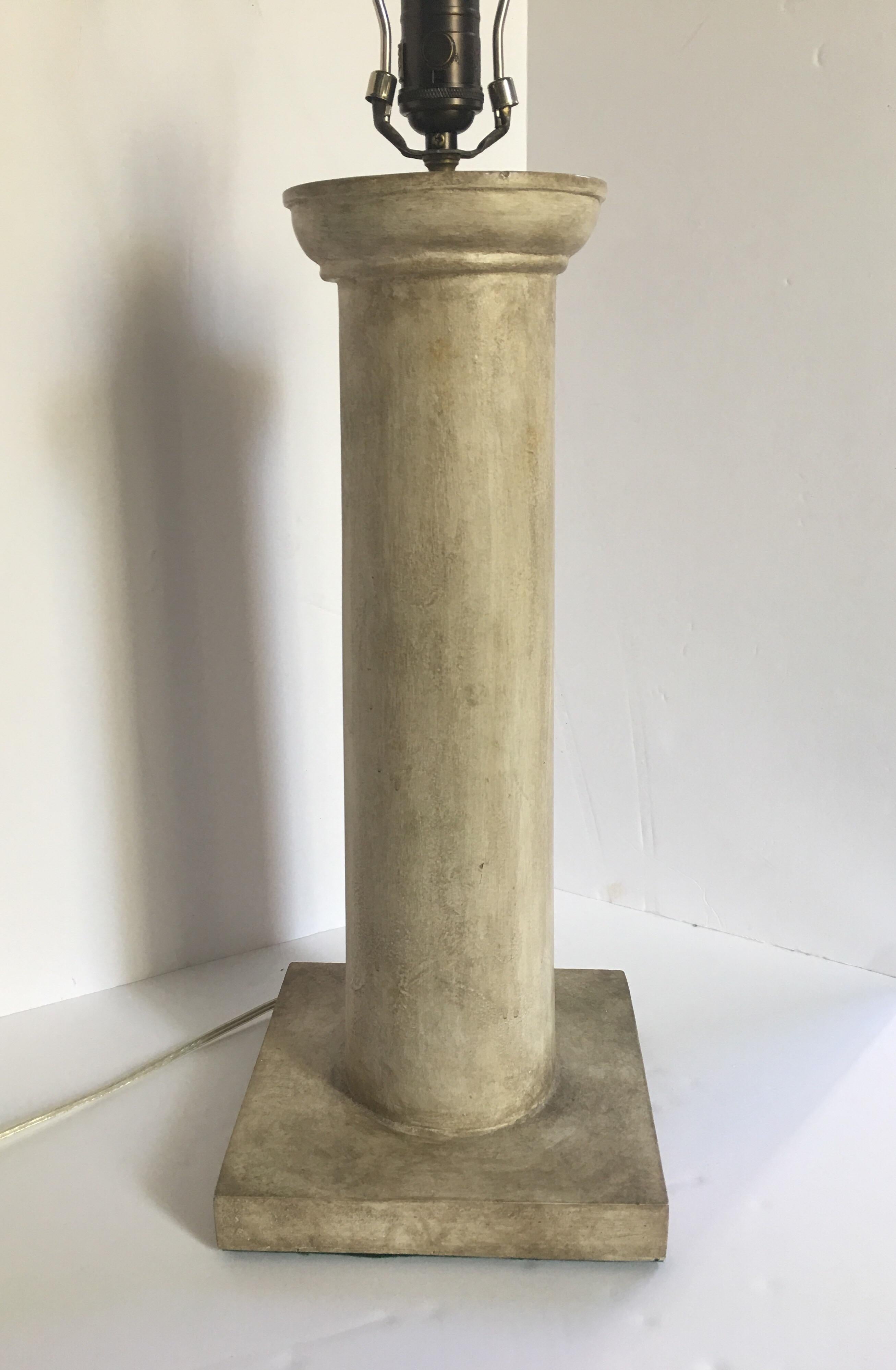 French Moderne Neoclassical Revival style Michel table lamp by Niermann Weeks. Solid plaster column body features cream washed finish with bronzed hardware. Metal Niermann Weeks label on socket. Lamp Shade not included. In the style of Jean-Michel