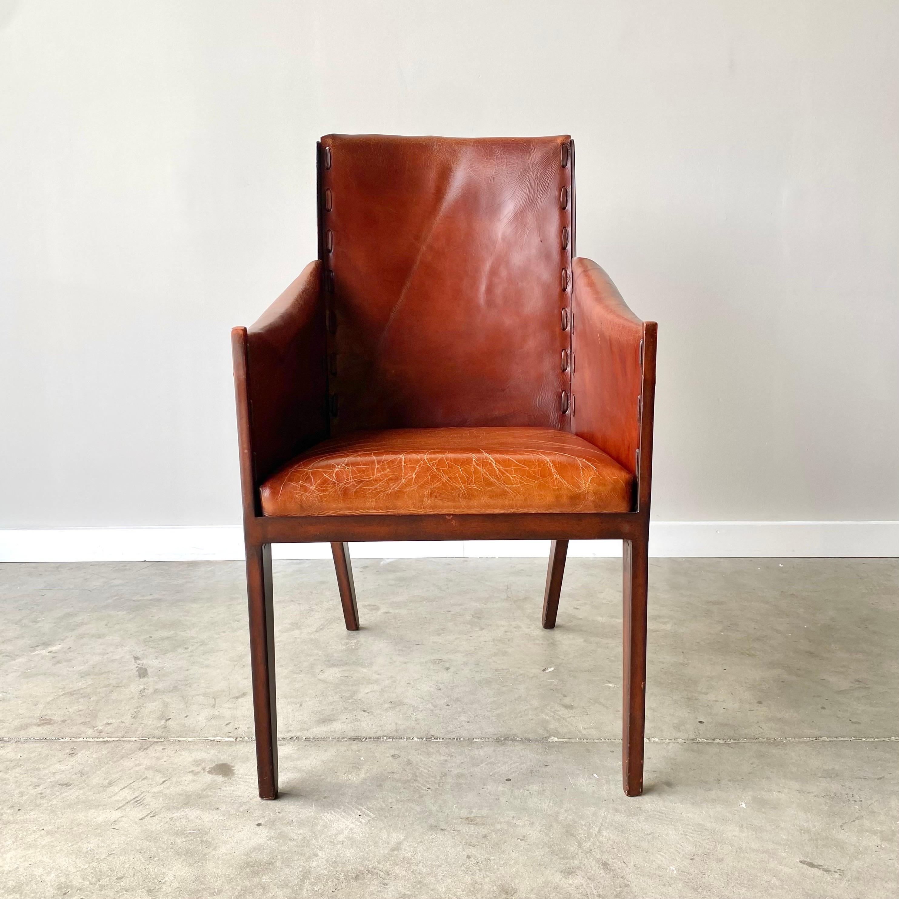 A striking pair of leather and steel armchairs.  A contemporary pair in the style of Jean-Michel Frank.  Tied leather seats over painted metal frame, stunning and comfortable.

