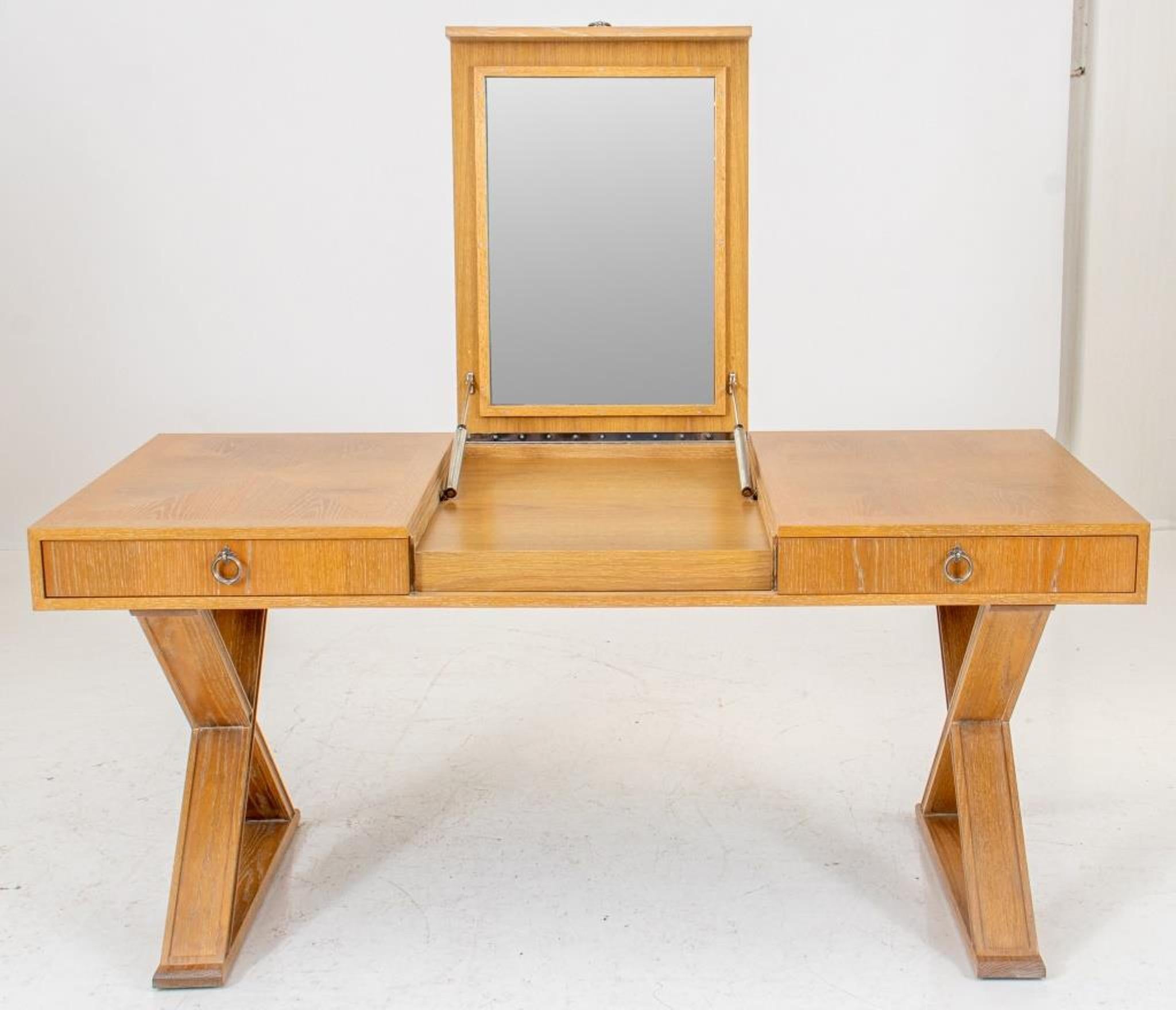 Jean Michel Frank (French 1895 -1941) style large cerused oak dressing table, the rectangular parquetry top opening to reveal a center dressing cavity fitted with mirror flanked by two short drawers each with silvered bronze ring pulls, supported by