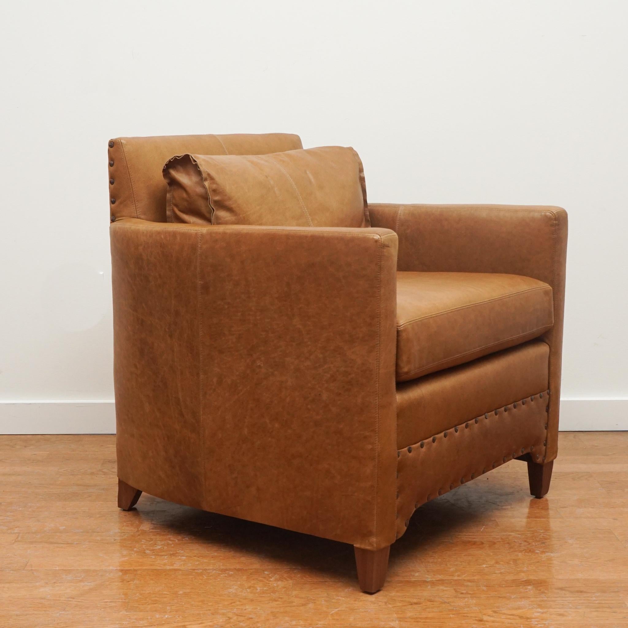 Drawing inspiration from Jean-Michel Frank, this Jean armchair by Verellen is small in scale but big on design and comfort. Shown here in Bozeman Tobacco Brown leather, the chair features spring down seat construction with feather and down back