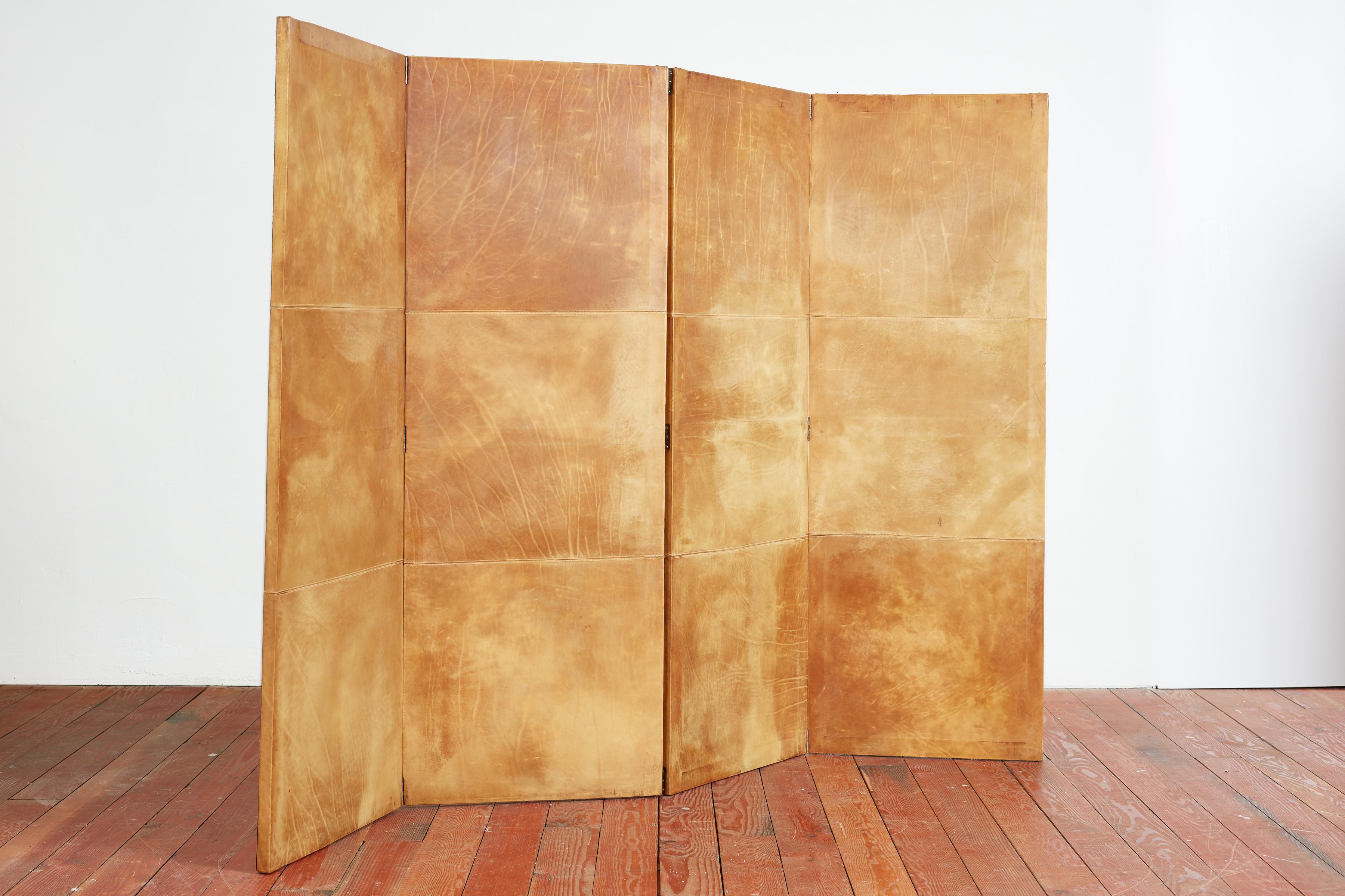 1940's French leather floor screen in the style of Jean-Michel Frank. 
Four panels total - each with wonderful patina to leather. 
Each Panel - 67.5 x 24. All measurements are in inches.