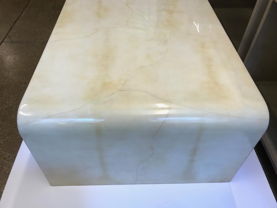Natural Vellum Parchment water fall shape coffee table with resin finish 
Custom size and colors available.