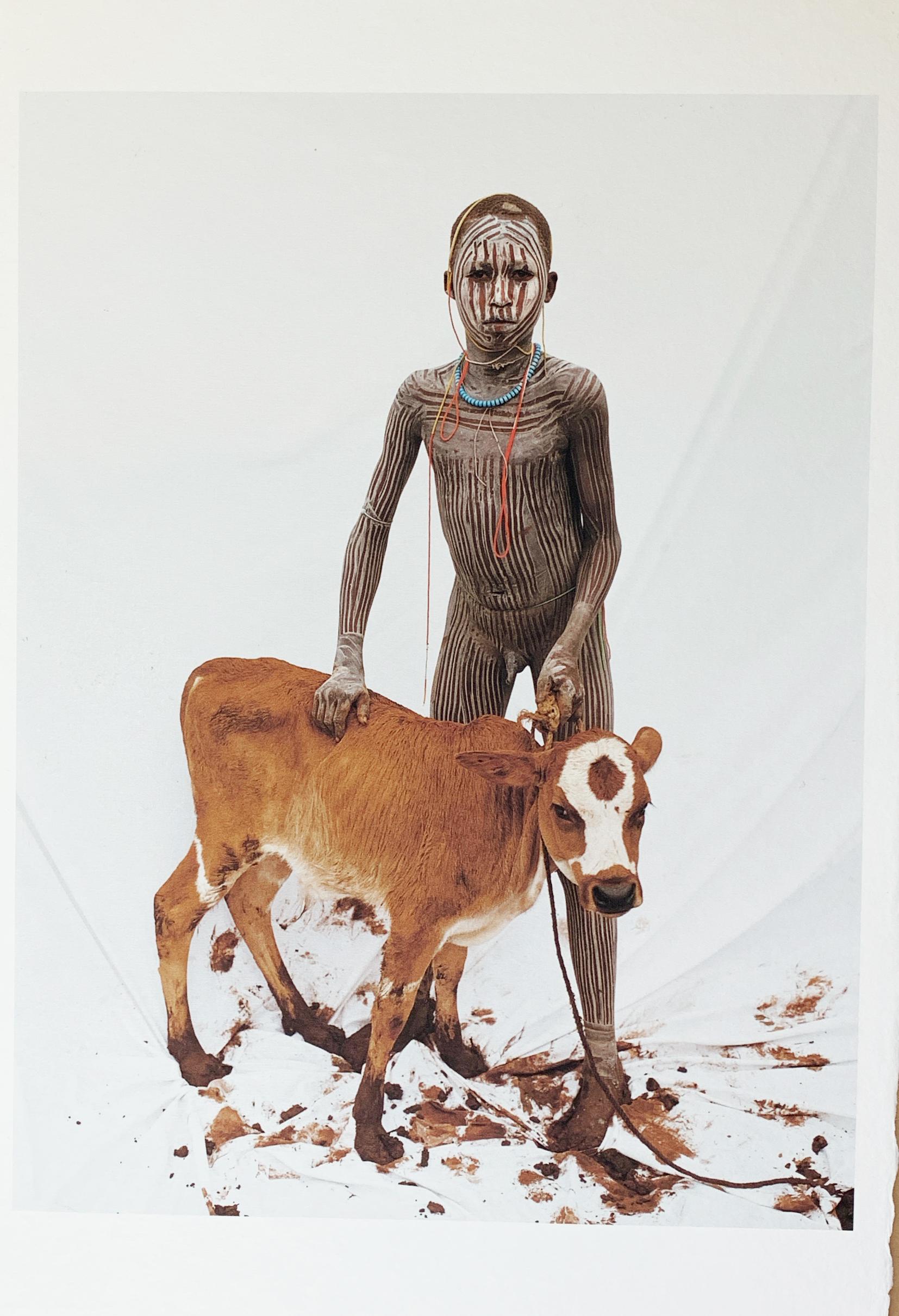 Jean-Michel Voge Color Photograph - Boy with Calf, Tribal Child in Ethiopia, Africa, Japanese Paper Limited Edition