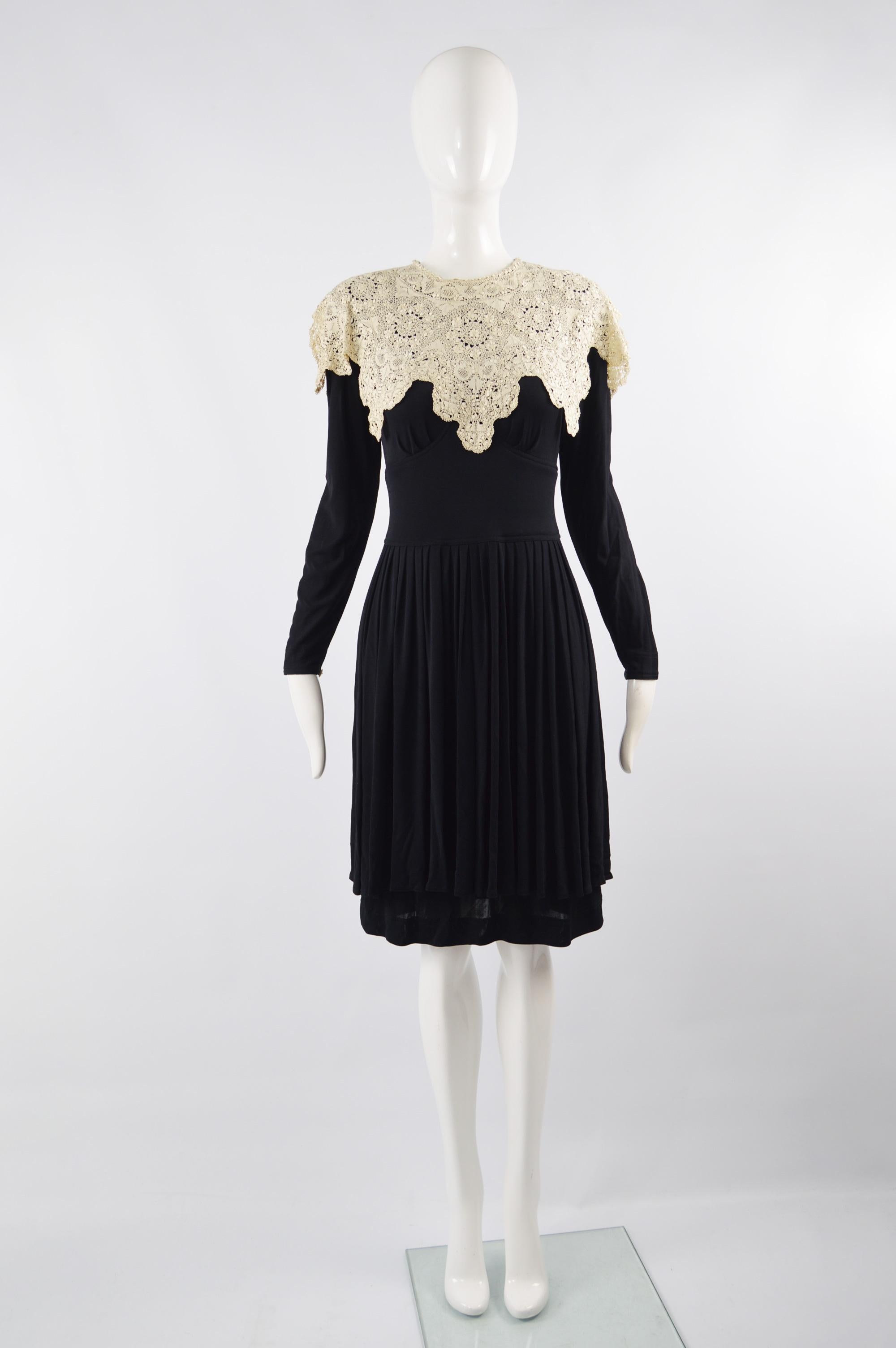 A fabulous vintage Jean Muir dress from the 70s in a black jersey with an intricate antique/ vintage lace collar and a tiered skirt. Perfect for a glamorous look in the day or worn in the evening as a statement party dress. 


Size: Marked UK 10 /