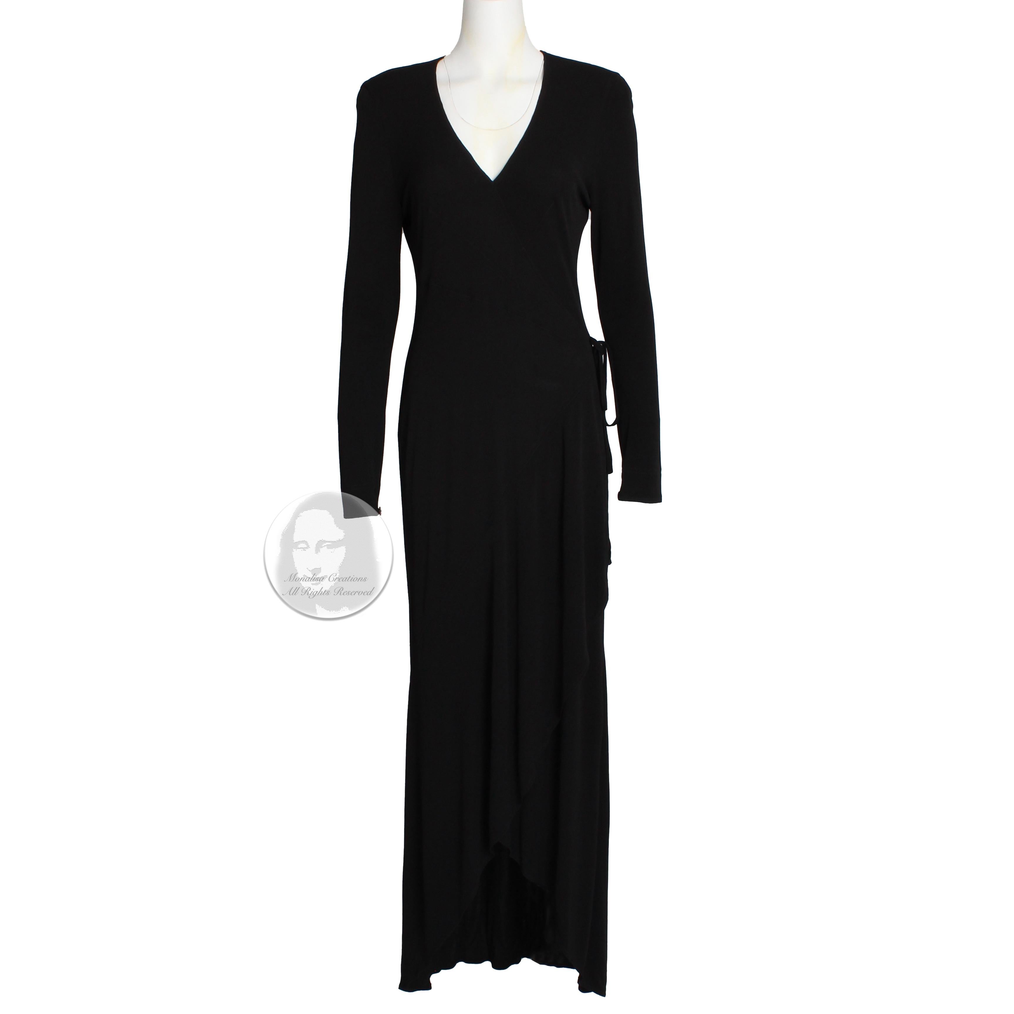Fabulous Jean Muir! This understated yet stunning long maxi dress features Muir's signature design elements: flowing jersey fabric, tons of movement and figure-flattering construction.  Made from black jersey, it has small shoulder pads, a low cut