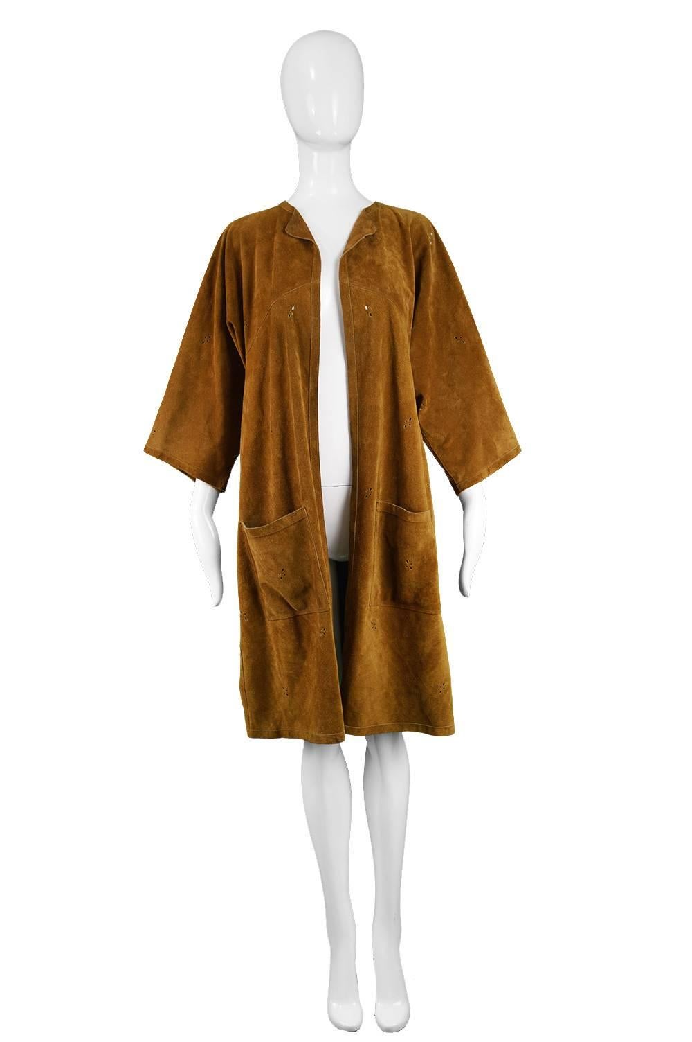 Jean Muir Vintage 1970s Punchwork Brown Suede Duster Jacket

Size: Marked UK 12 / US 10 but would suit a women's Small to Medium due to loose open fit
Bust - up to 38