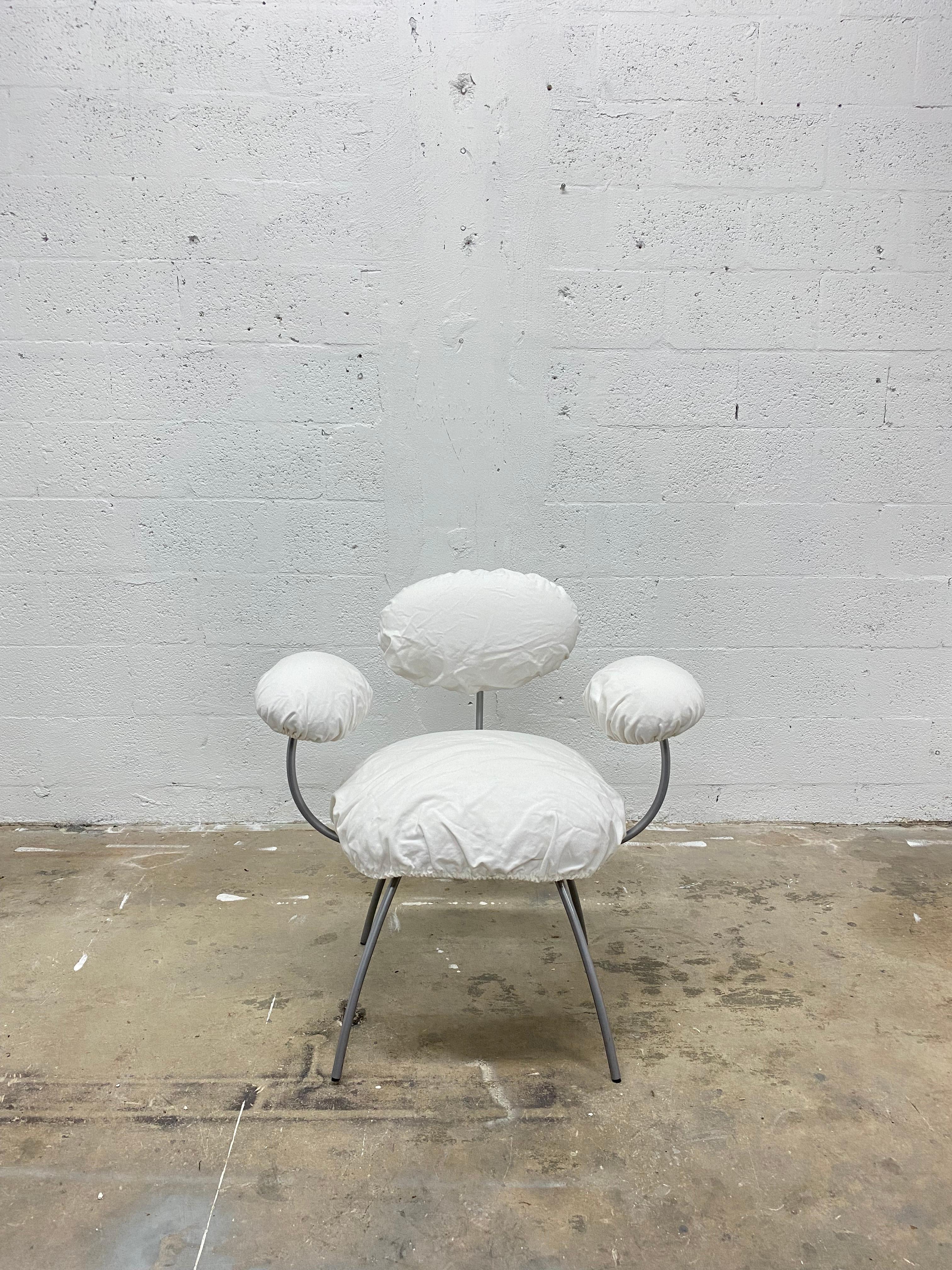 Single Saint James dining arm chair with white linen slip covers by Jean Nouvel for Ligne Roset.

The frame is fully fabricated in aluminium-coated Epoxy-lacquered tempered steel. Feet have polyethylene castors. Backrest, armrest and seat cushion