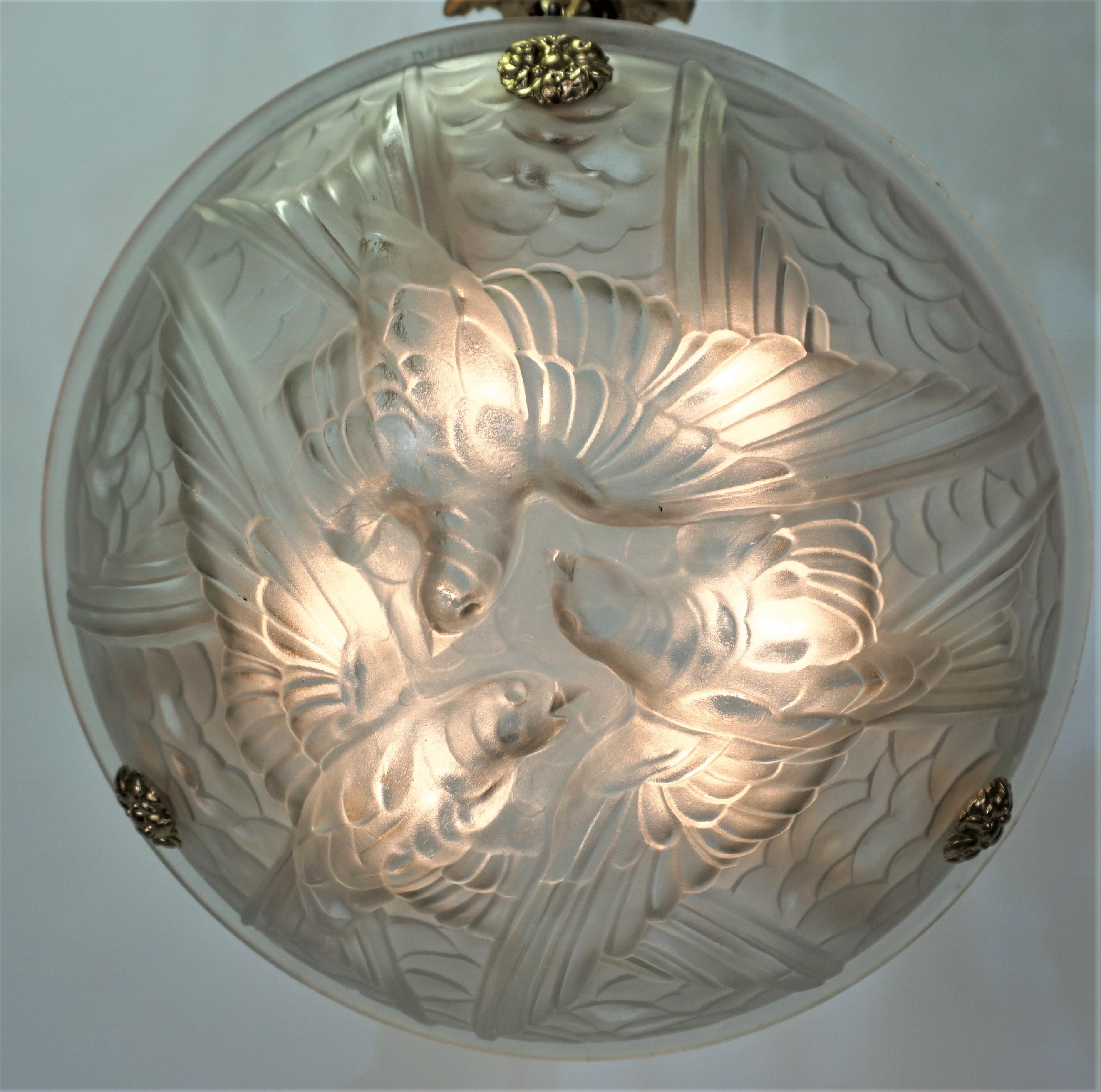 Frosted clear glass with bronze hardware Art Deco chandelier.
Six-light max 75watts max each.