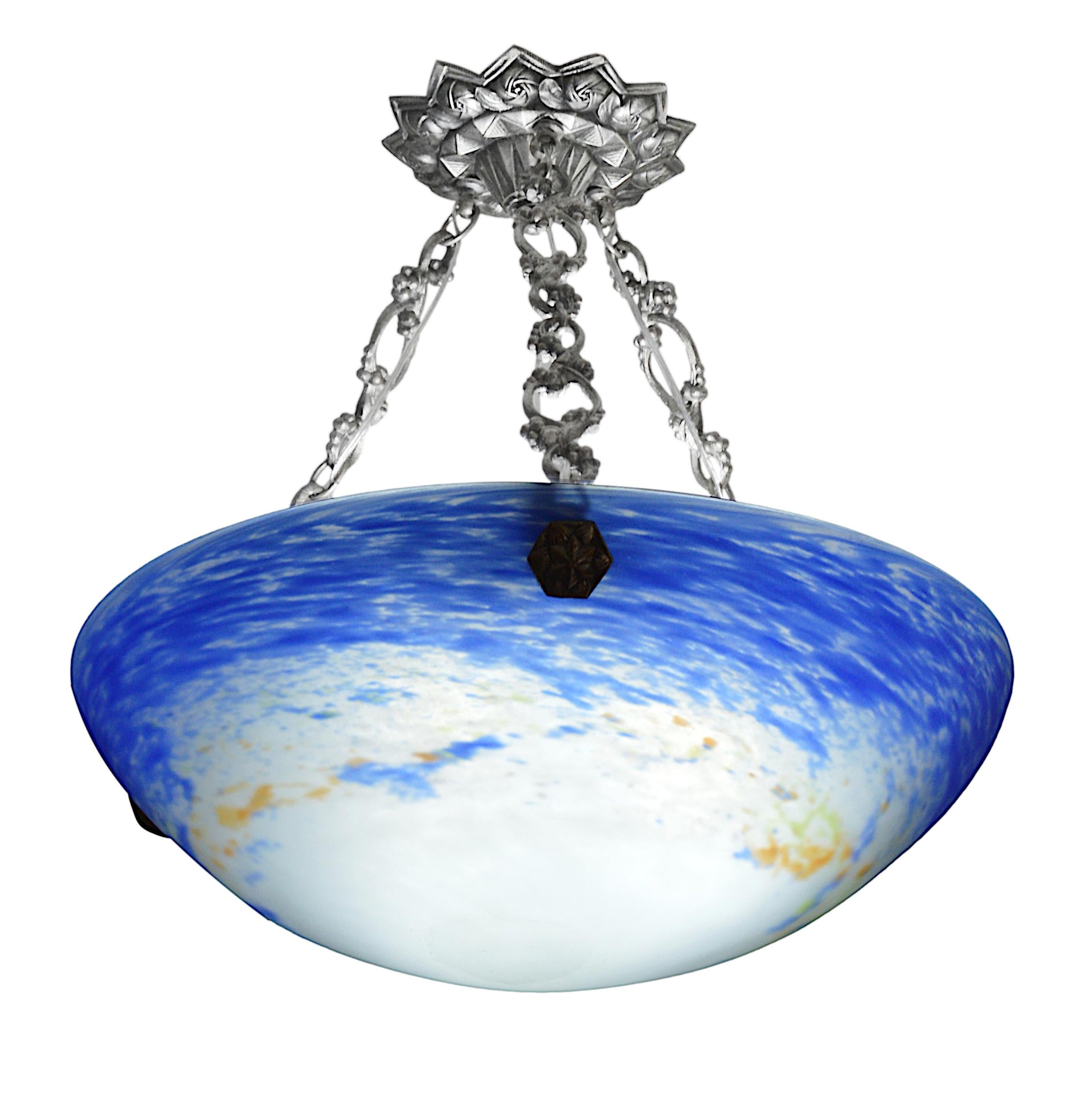 French Art Deco pendant chandelier by Jean NOVERDY (Dijon), France, 1920s. Mottled blown thick double glass shade. Colors : blue, ochre, green and white. Solid bronze fixture (even the links of the chains). Height : 13.8