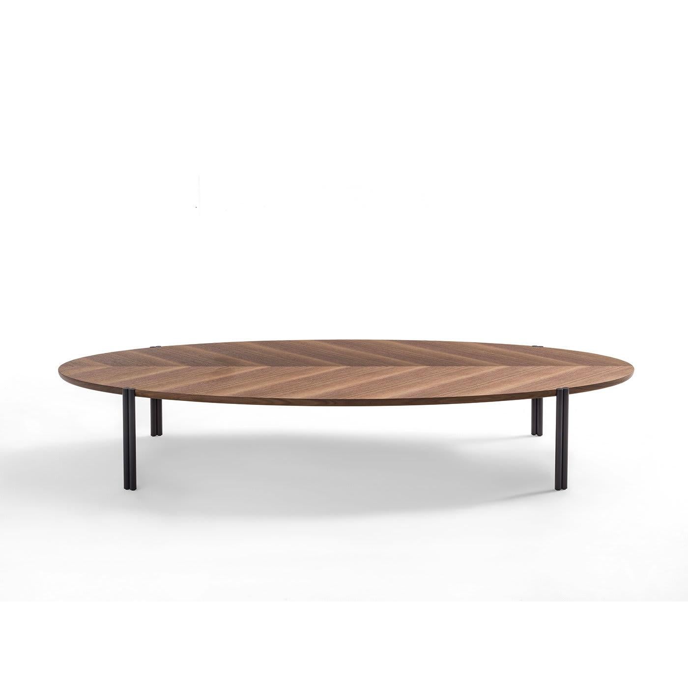 The Jean Ordinary coffee table is simple and stylish in design and will perfectly adapt to any environment, with either classic or modern decor. Crafted from wood, the top is available in Canaletto walnut or black ashwood, with the legs