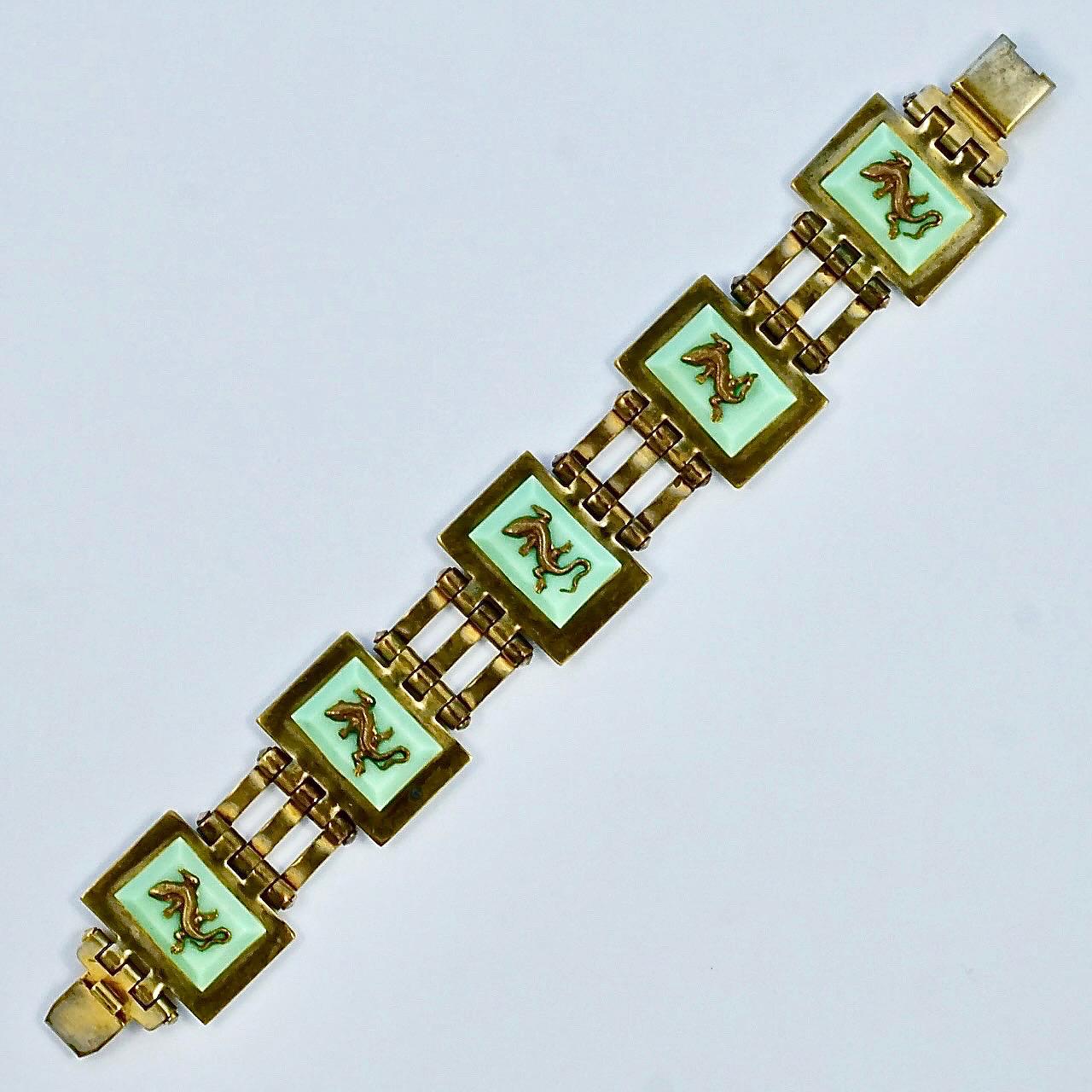 Fabulous Jean Painlevé French Art Deco gold plated link bracelet, with mint green Bakelite, and featuring five salamanders. Measuring length 17.7cm / 6.9 inches by width 2.4cm / .9 inch. The bracelet has wear to the gold plating and scratching. The
