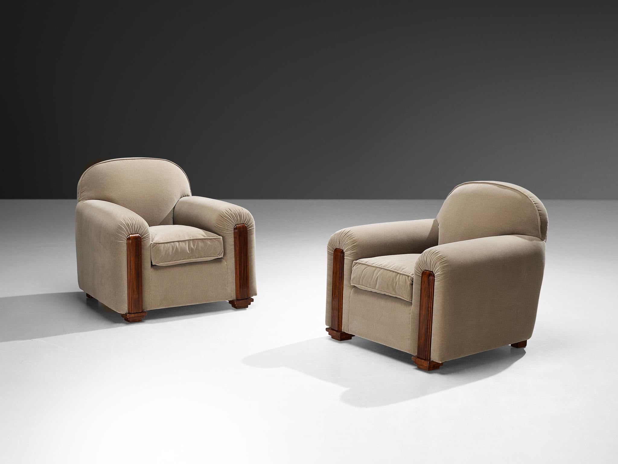 Jean Pascaud, pair of lounge chairs, velvet fabric, wood, France, circa 1932

These armchairs, designed by the acclaimed French designer and interior decorator Jean Pascaud around 1932, showcase a refined elegance with their robust form, rounded