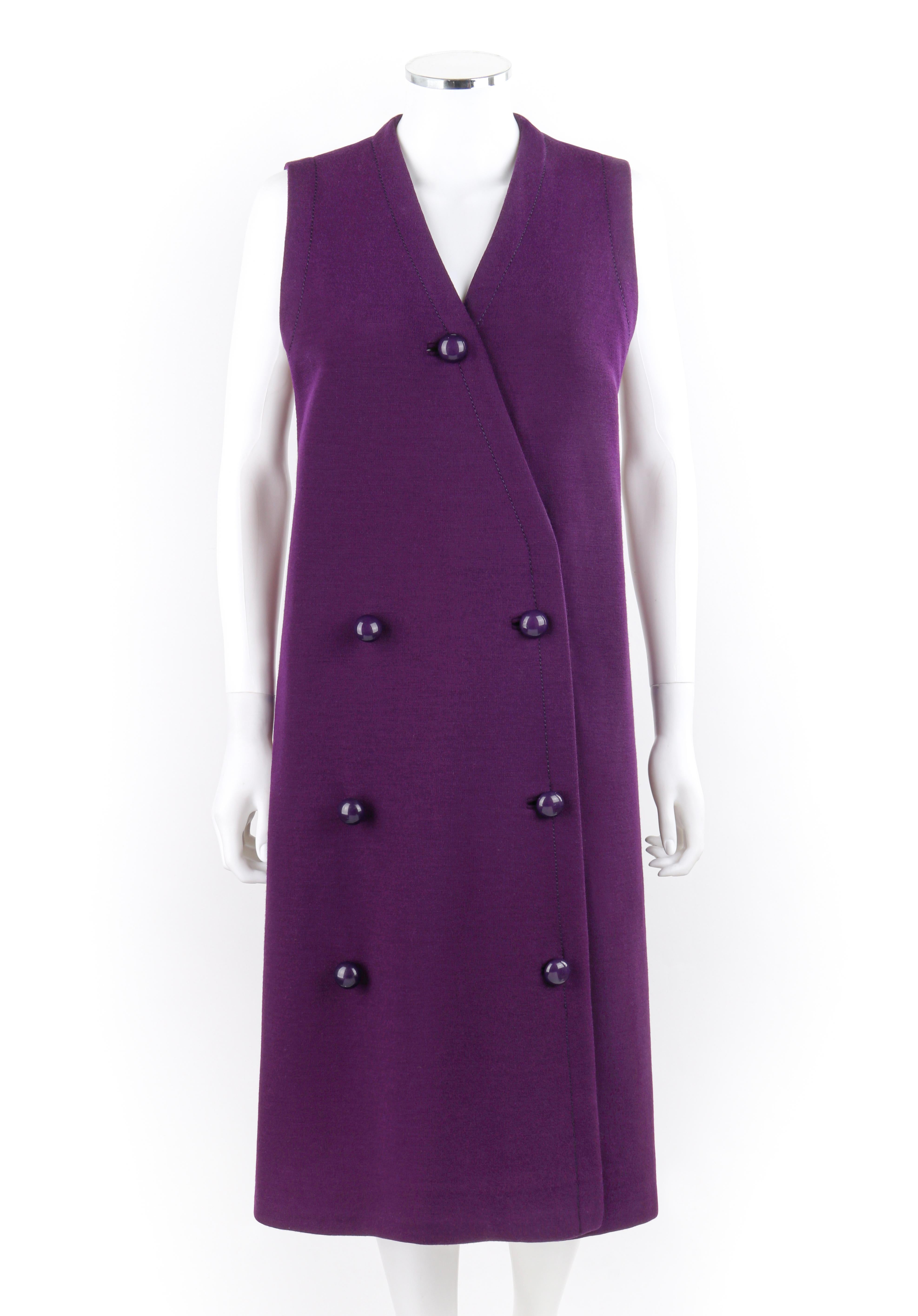 JEAN PATOU c.1960's Purple Sleeveless Double Breasted Button Front Mod Shift Dress
 
Circa: 1960's
Label(s): Jean Patou Boutique Paris Exclusively for Saks Fifth Avenue
Designer: Michel Goma, Jean-Paul Gaultier
Style: Shift midi dress
Color(s):