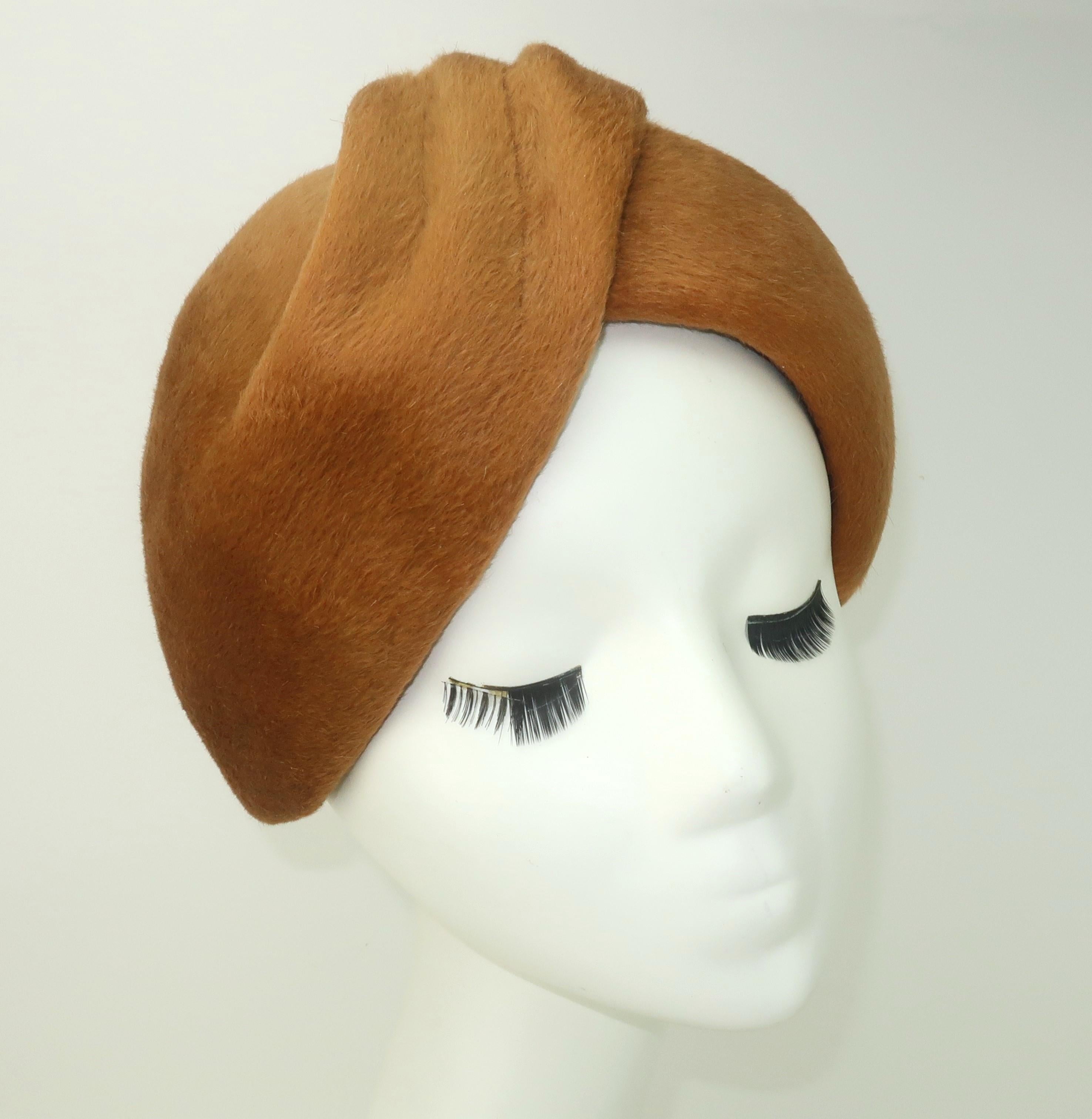 Faboo!  1960's Jean Patou fur felt hat with a turban silhouette in a yummy caramel brown color.  The hat appears to be an effortless twist of fabric with a ruched design at the front finishing to two tails at the back.  The felt appears to be
