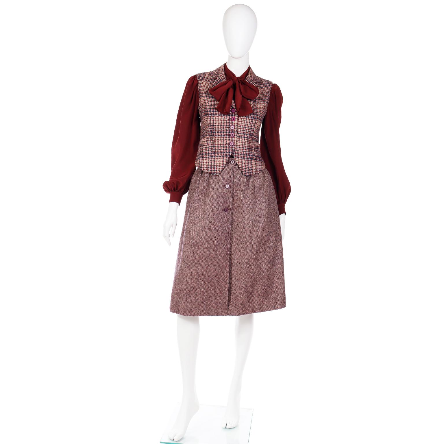 This is a very rare vintage Jean Patou Boutique 3 piece burgundy wool plaid ensemble that includes a vest, bow silk blouse and culotte skirt. We love the unique way the culottes are designed with shorts and a wrap around skirt. We've tried to show