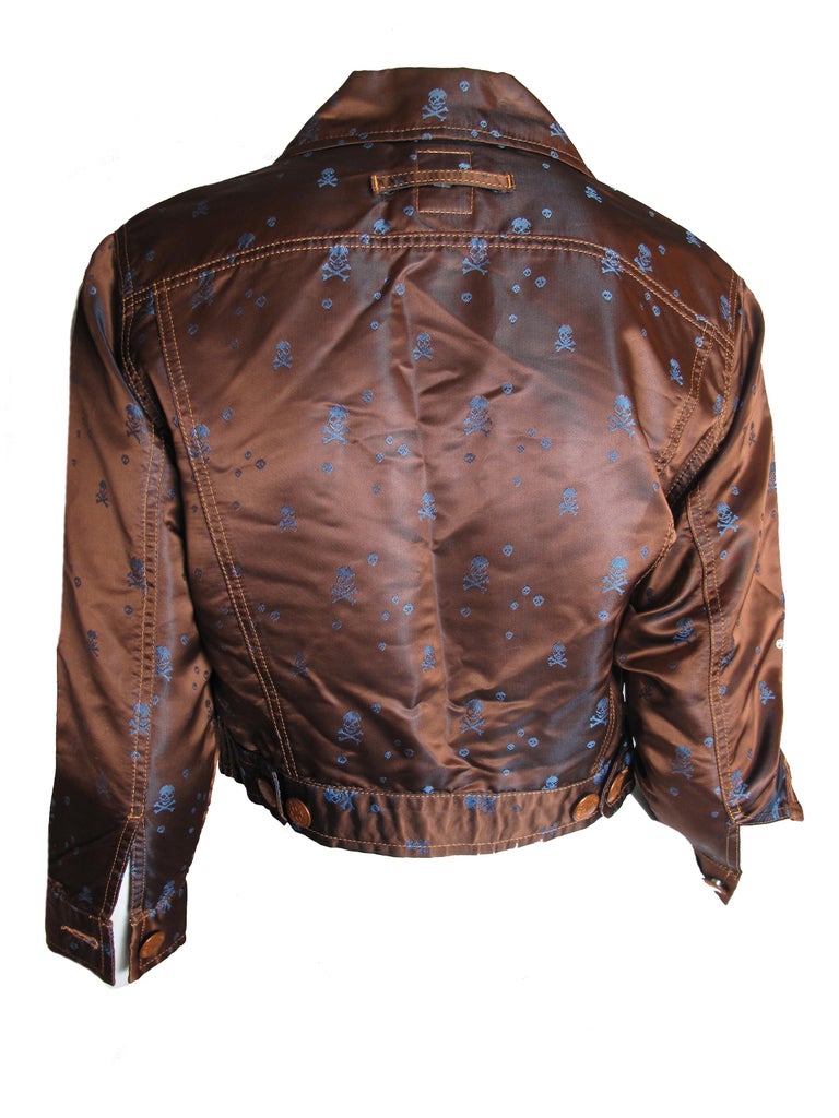 1980s Jean Paul Gaultier cropped brown satin jacket with blue skull print.  Condition: Excellent. Size Small ( mannequin is US size 6 )