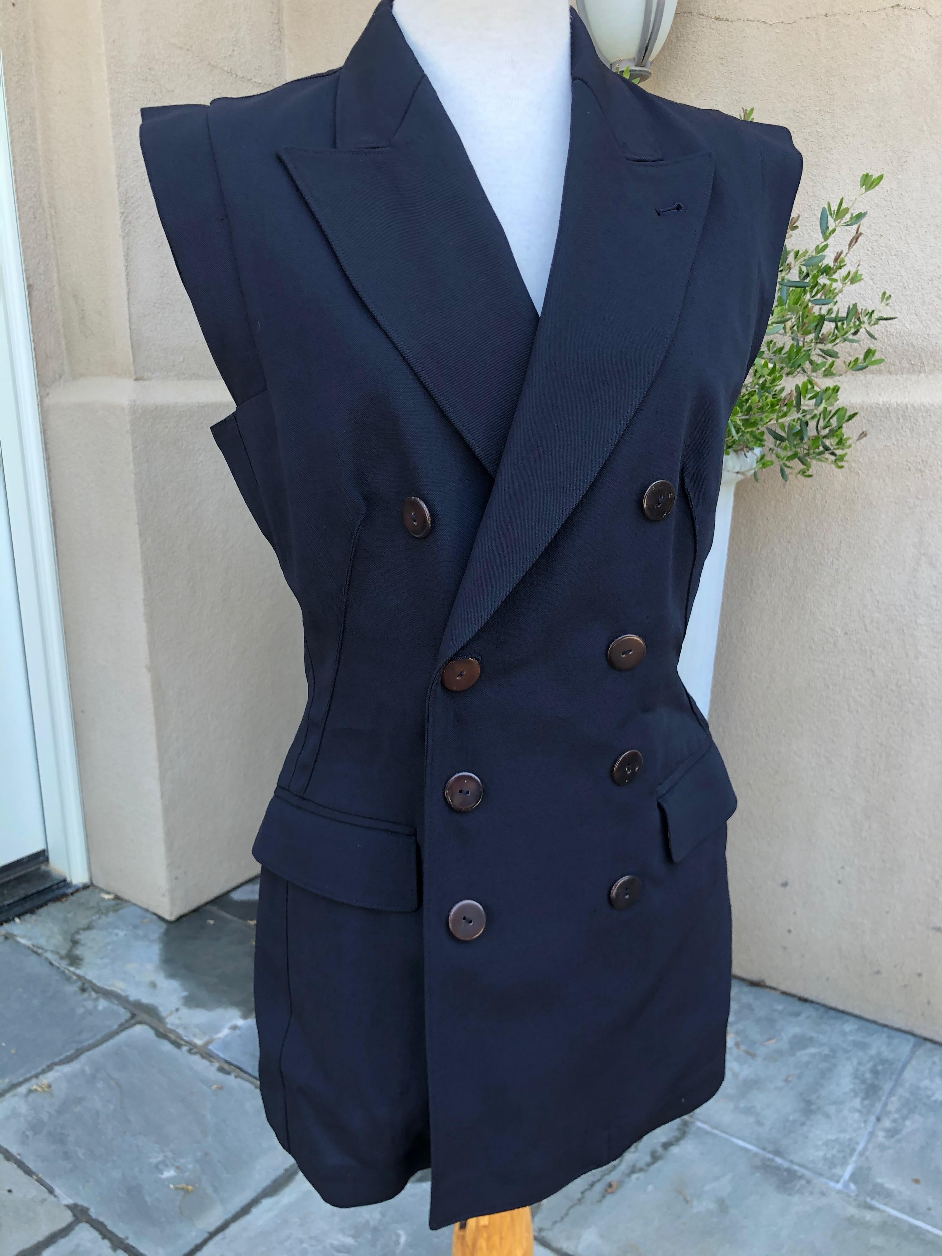 Jean Paul Gaultier 1980's Sleeveless Tuxedo Jacket .
Unisex, it would fit a small man.
Size 36 Fr
Bust 36
