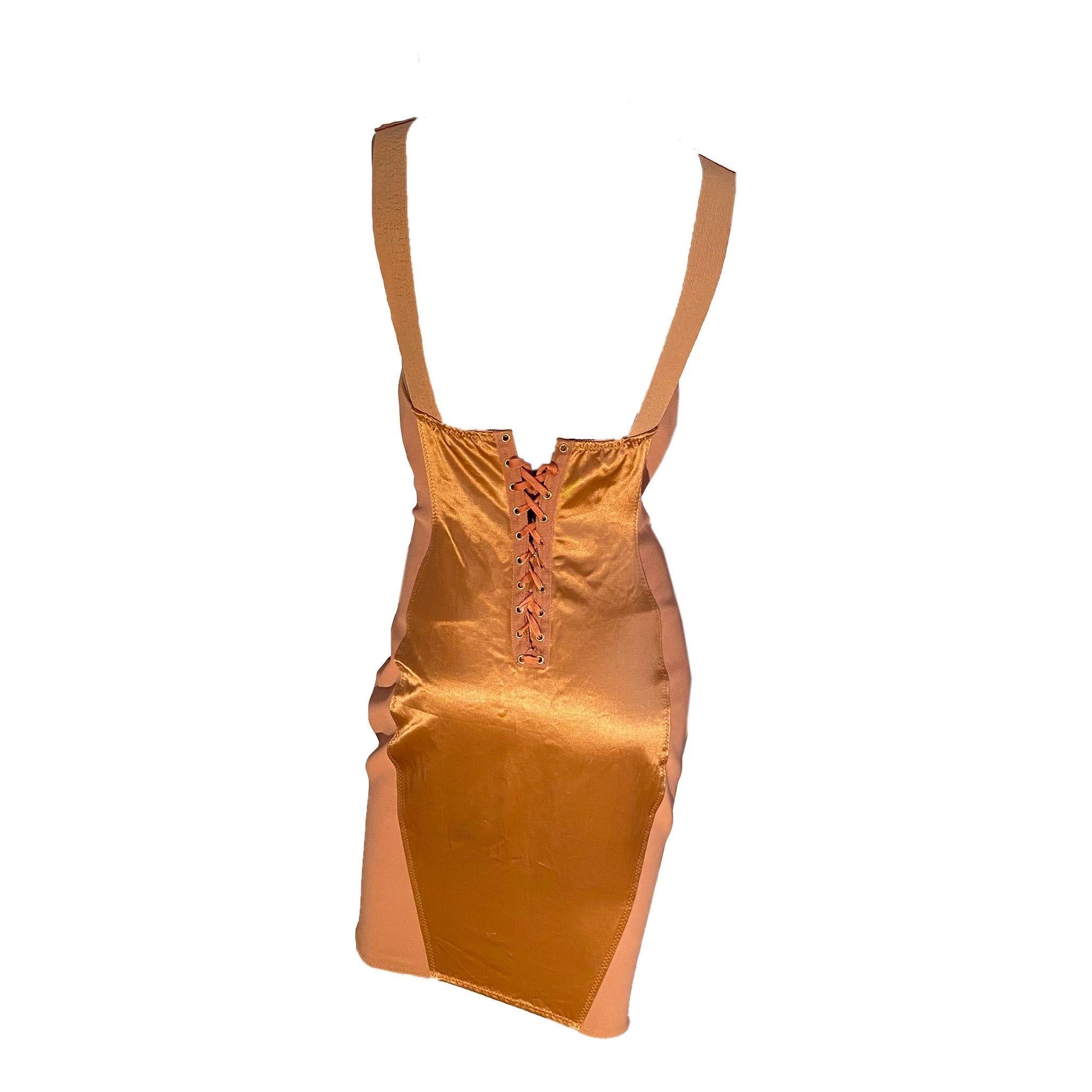 Jean Paul Gaultier 1989 Iconic “Cone Bust” Corset Dress

Jean Paul Gaultier Late 80s Junior Salmon Corset Dress with signature “Cone Bust”, popularized by Madonna. Front Zipper closure with Lace-Up Back system.

Left strap has some signs of