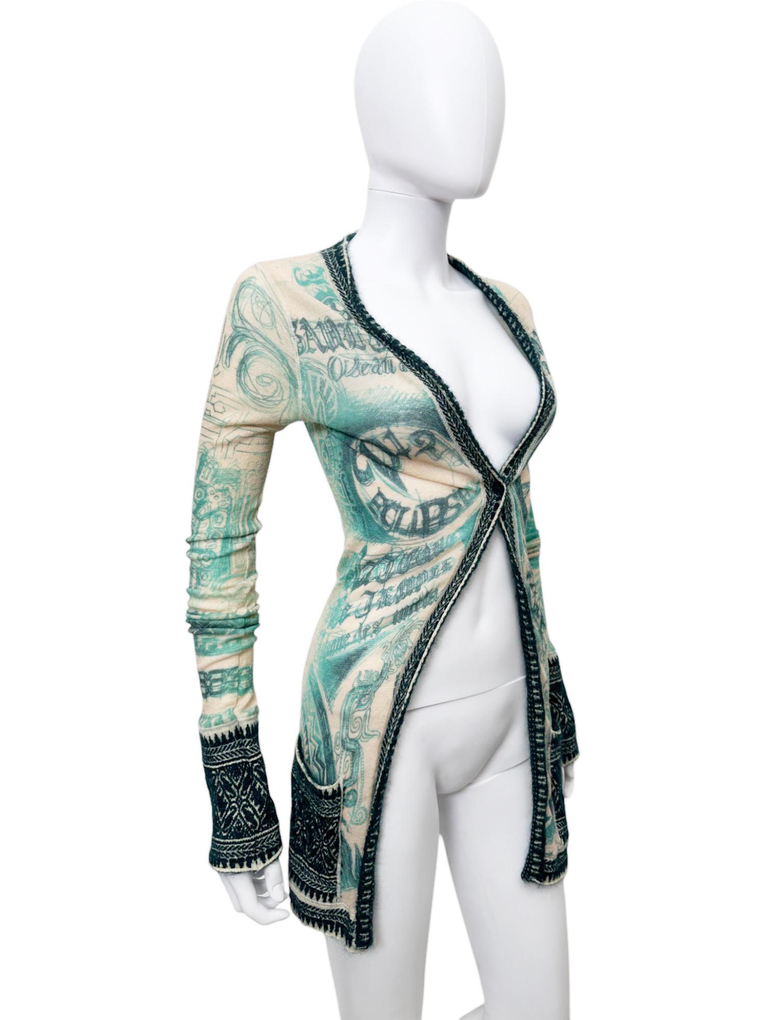 - Designed by Jean Paul Gaultier
- 1990's
- Wool Cardigan
- One button closure
- Tribal Prints all-over
- Two pockets on the front
- Made in Italy
- Excellent Condition
- Materials: Wool, Nylon and Mohair
- Size: FR 40 - EN 44 - UK 12 - US 8 -