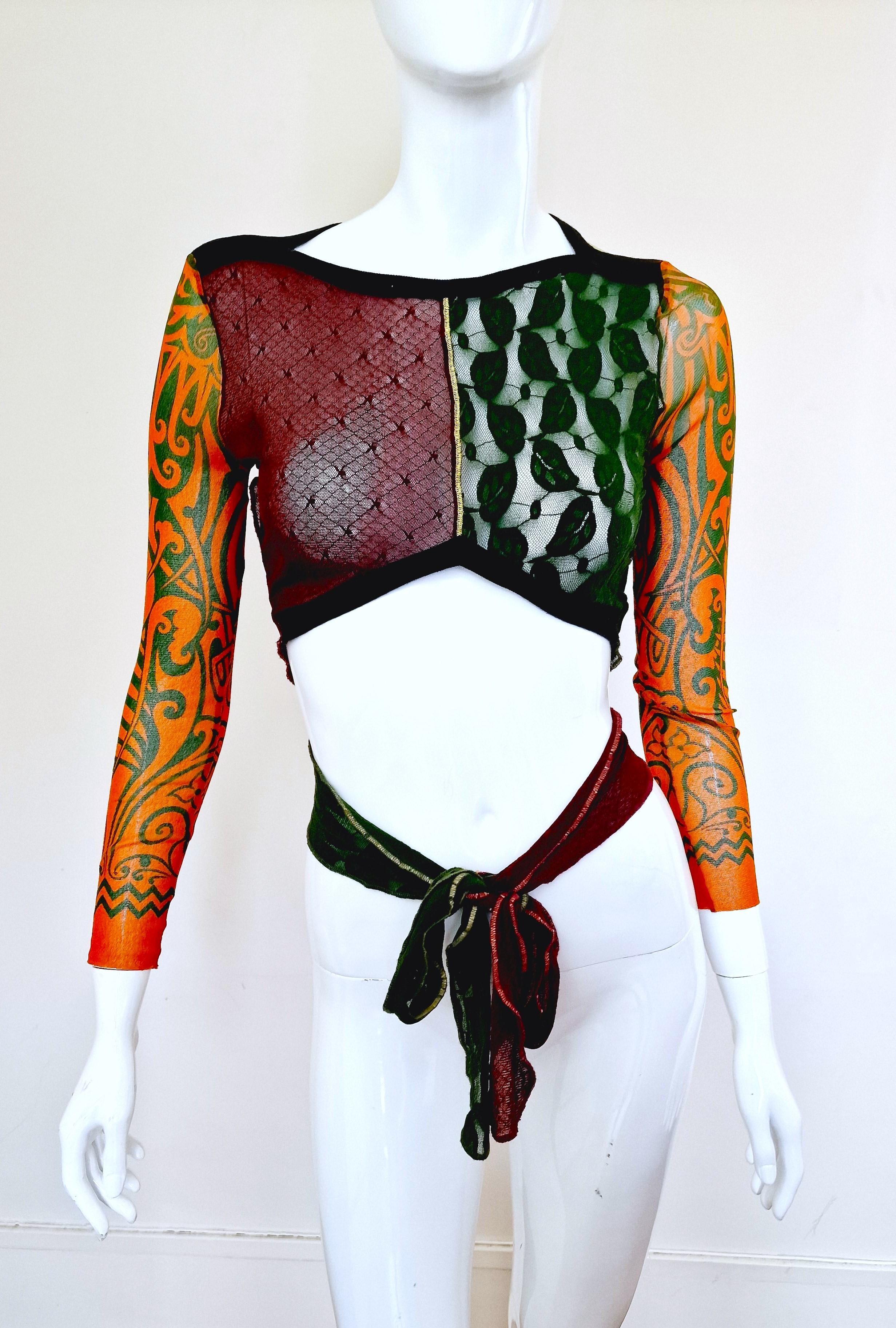 Iconic tattoo top by Jean Paul Gaultier!
From the 1996 S/S collection!
JEAN PAUL GAULTIER Maille vintage iconic and rare tattoo pattern. Colour block lace front, mesh tattooed sleeves and back. 
You can wrap it with different