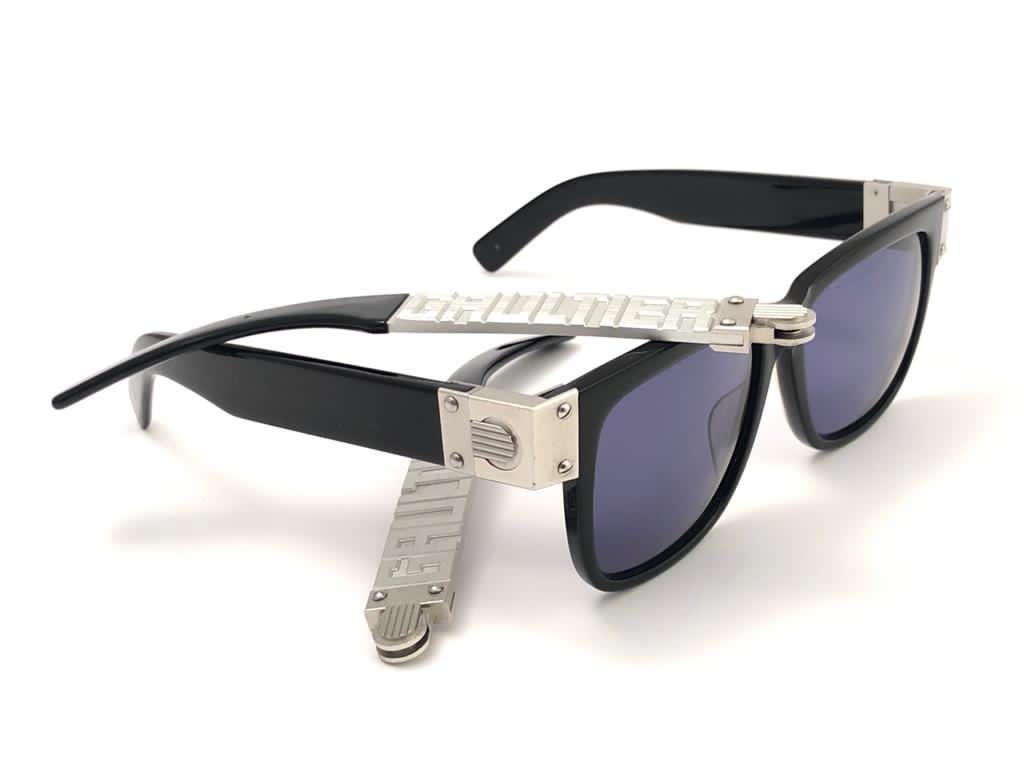 Collectors Item!!
Iconic Jean Paul Gaultier 56 8002 Black Silver Matte interchangeable temples frame. 
Dark blue lenses that complete a ready to wear JPG look.
The very same model worn by Vanilla Ice in 1990's.
Amazing design with strong yet