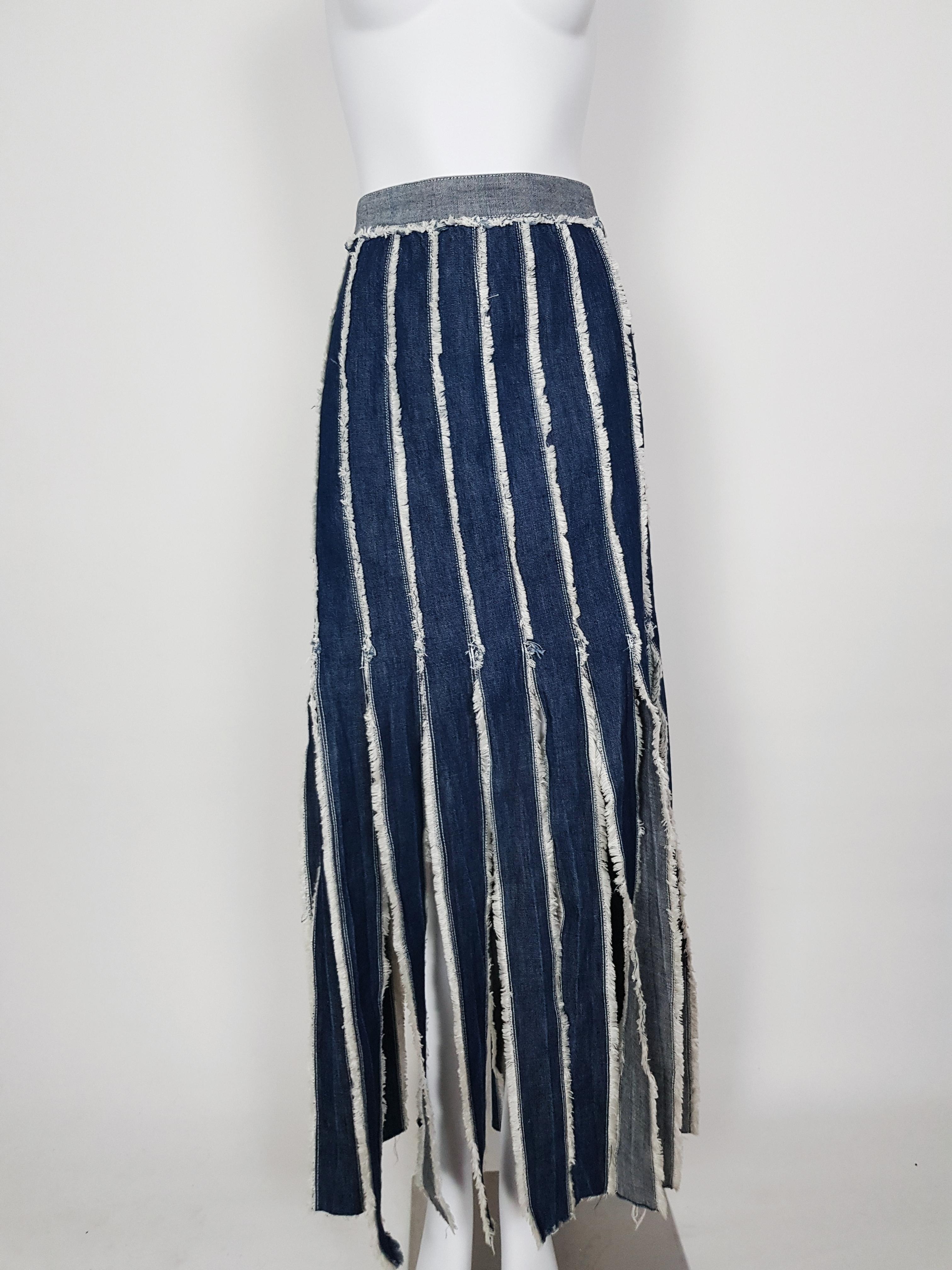 Blue denim skirt with fringe trim by Jean Paul Gaultier, wear yours with the matching shirt.

-Frayed fringe details along seams and hems
-Metal zipper and logo on the side
-100% Cotton
-Estimated size: 40 FR to 44 FR (marked as 44FR)
-Very good