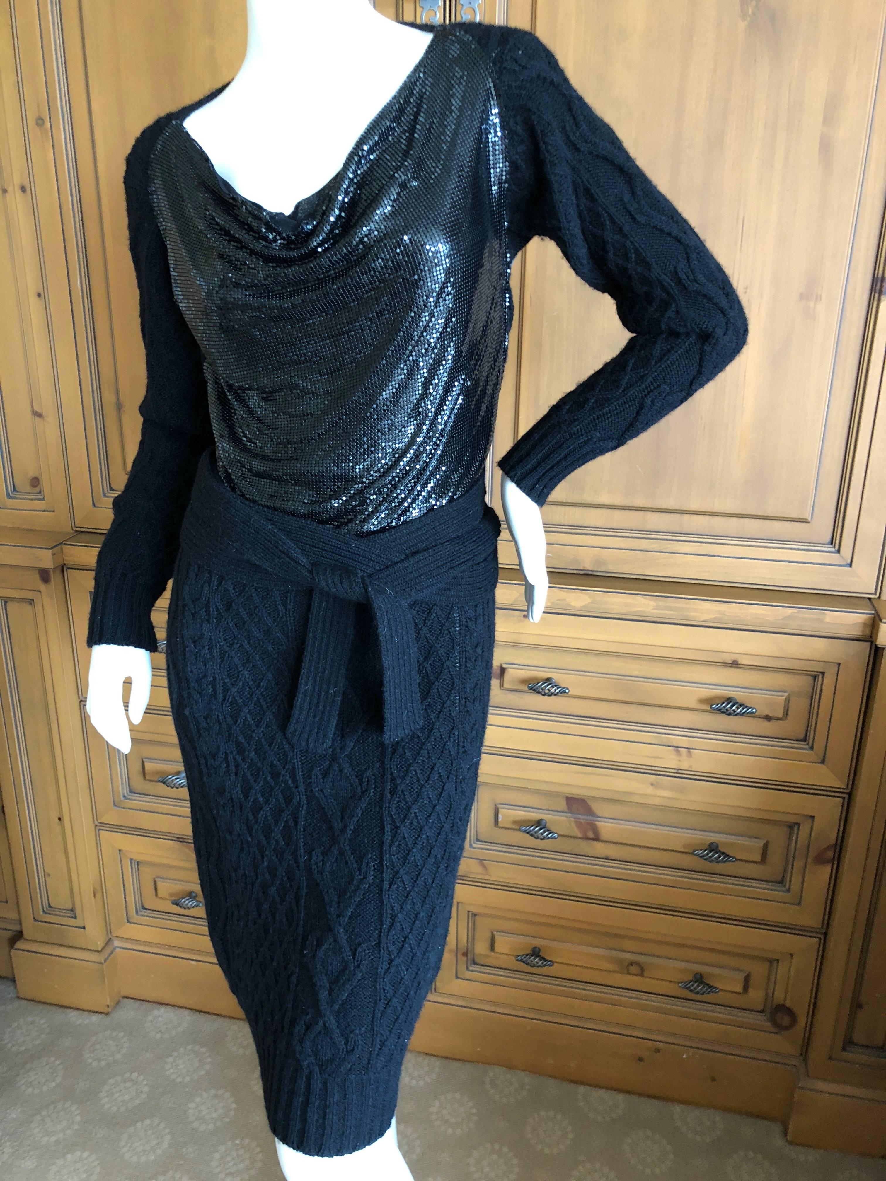Wonderful early Jean Paul Gaultier Maille angora wool blend cable knit dress with a draped black enamel metal mesh front.
It is much prettier in person, this was hard to photograph well.
Size S
Bust 36