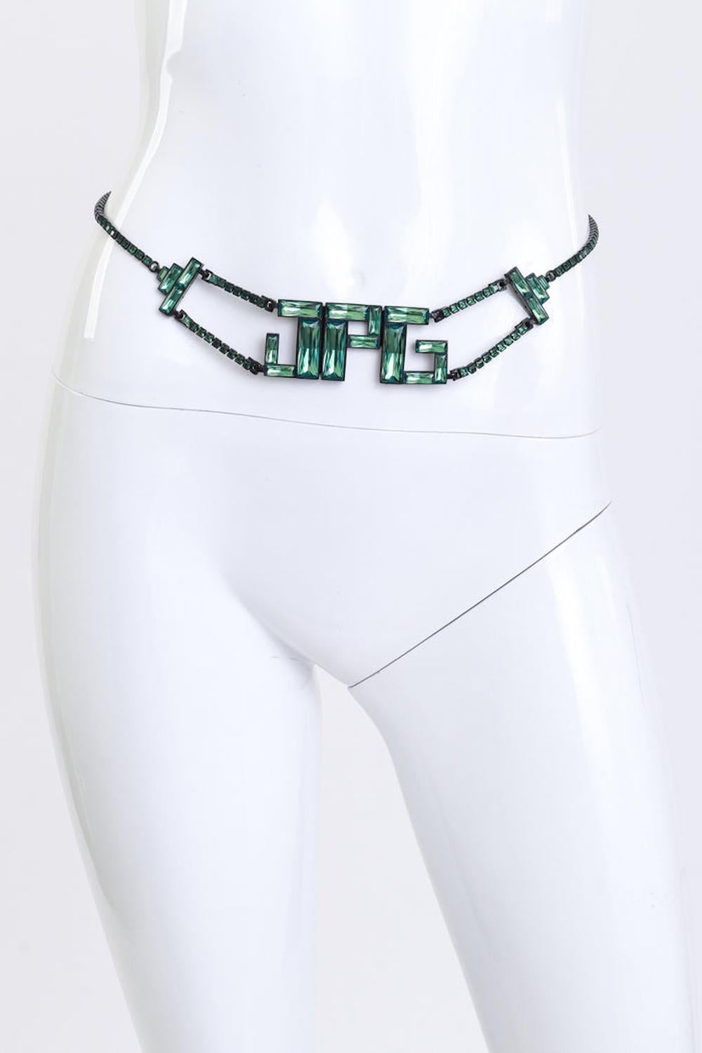 This hard-to-find crystal-encrusted statement belt showcases the initials of Jean Paul Gaultier, often hailed as the 