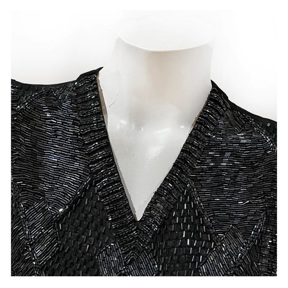 Beaded Vintage top by by Jean Paul Gaultier 
Made in Italy
Black 
V-Neck
Metallic beaded argyle embellishment covering front
Sleeveless
Functional zipper detail along left side seam and left collar
62% polyamide, 19% elastane
Condition: Excellent,