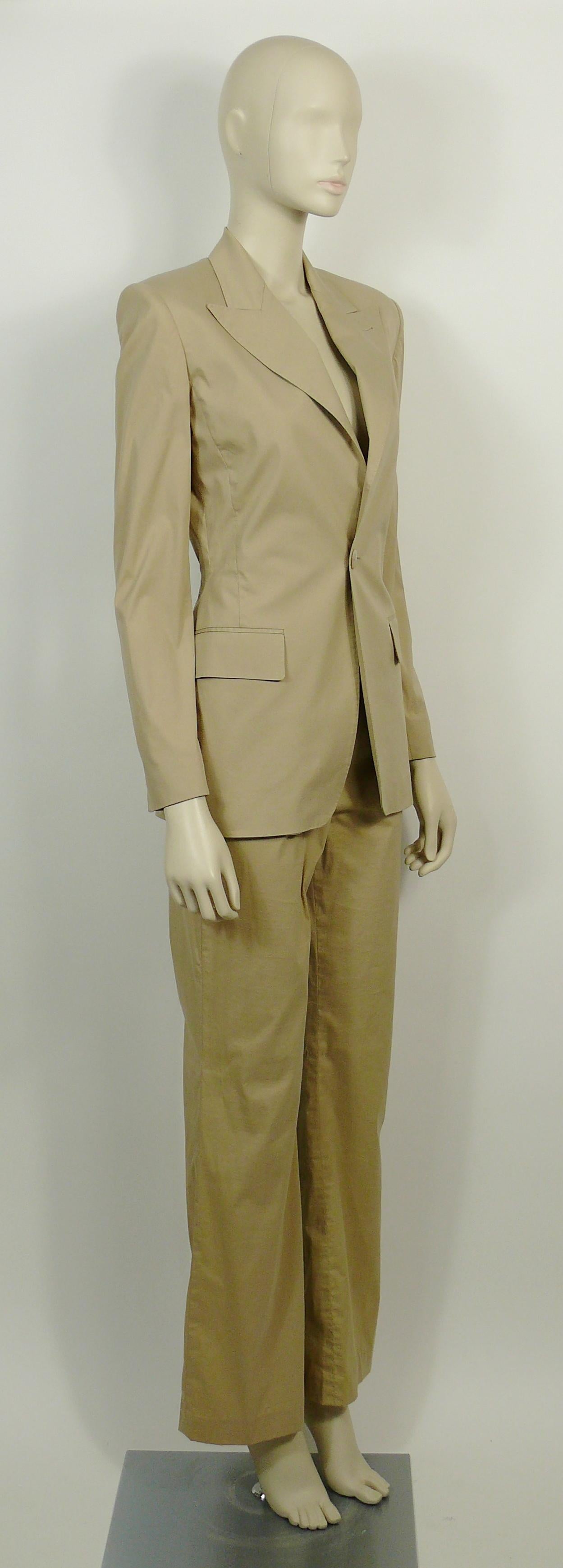 JEAN PAUL GAULTIER beige pant suit suit with an iconic cut-out back blazer jacket.

BLAZER features :
- JEAN PAUL GAULTIER's iconic cut-out back design.
- Lapel collar.
- Single front buttoning.
- Long sleeves.
- Single buttons at the cuff.
- Two