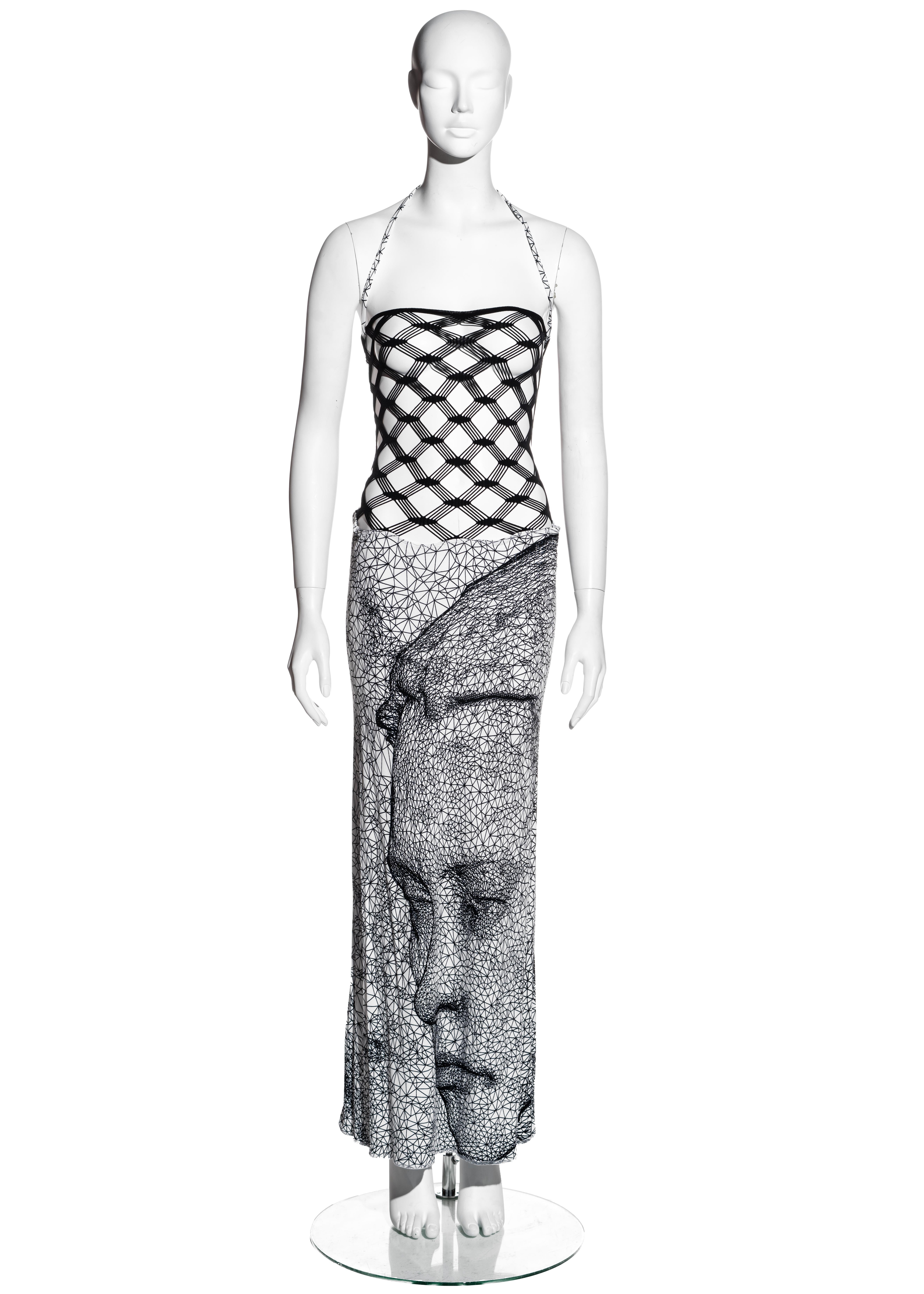 ▪ Jean Paul Gaultier black and white fishnet lycra maxi dress
▪ Black fishnet bodice
▪ Lycra maxi skirt with digital face print 
▪ Optional halter neck 
▪ Size Medium
▪ Spring-Summer 2001