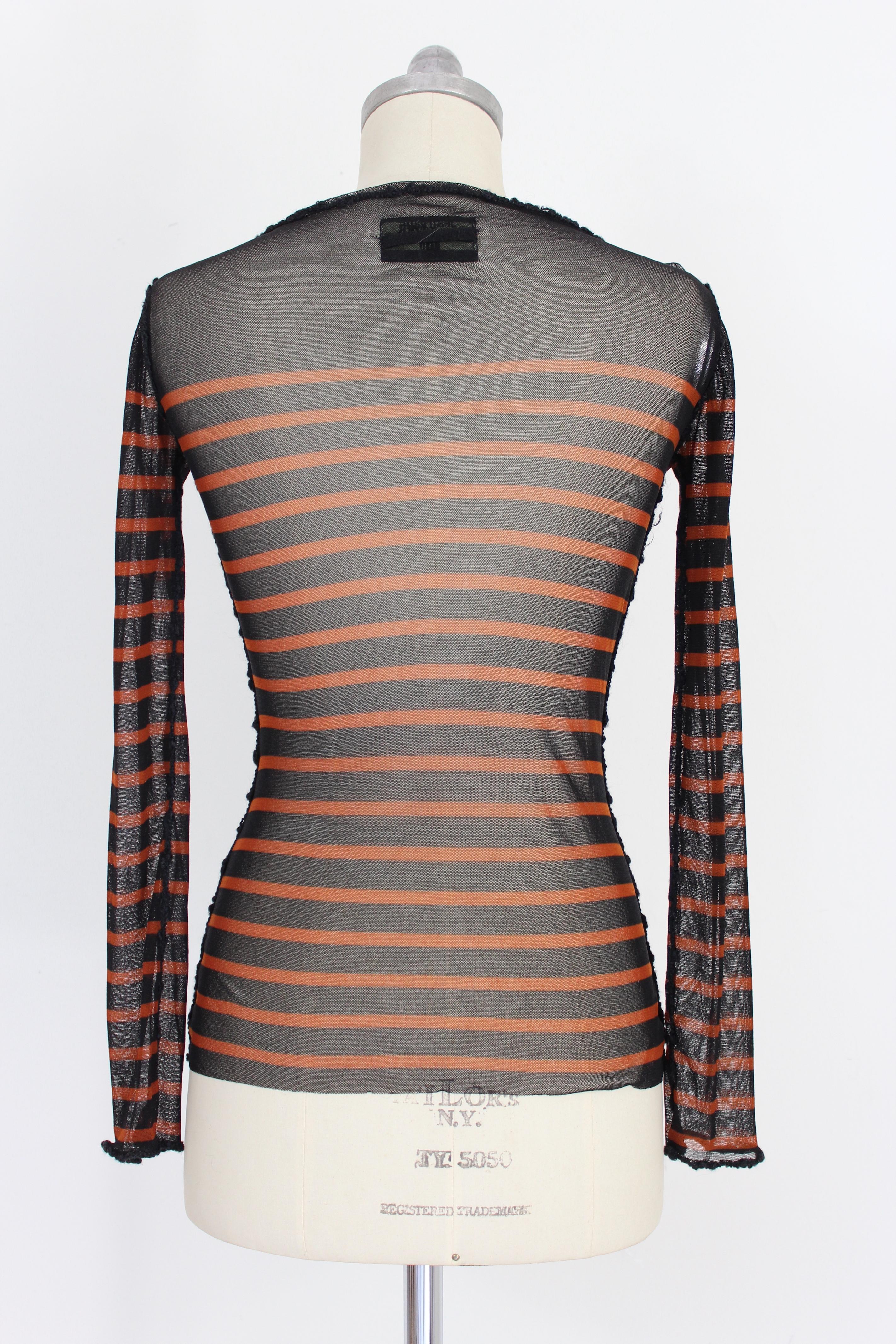 Jean Paul Gaultier Maille 90s vintage women's shirt. Crewneck, black and brown striped, transparent. There are wool applications along the edges and on the chest. Fitted model. Made in Italy.

Condition: Excellent

Item used few times, it remains in