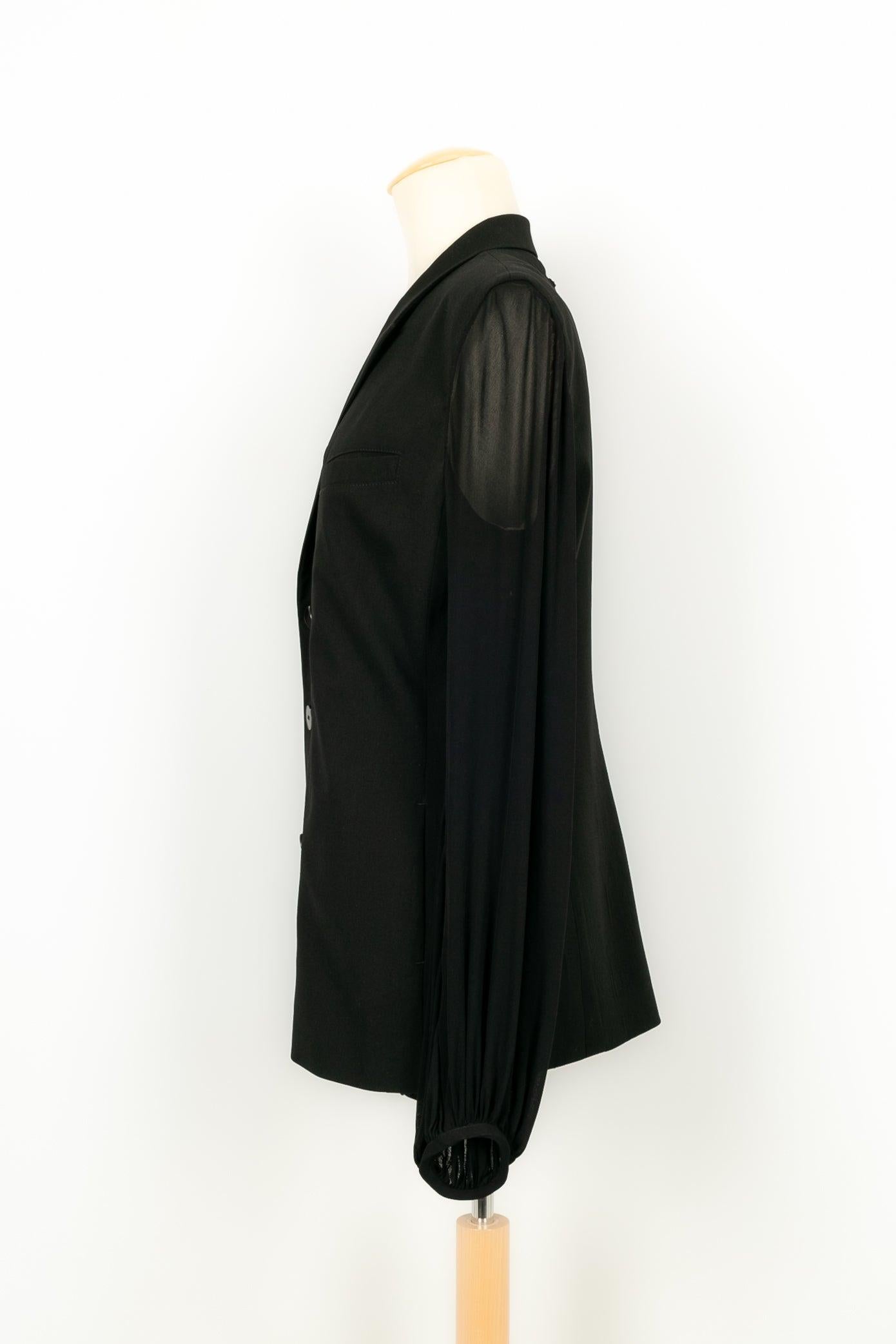 Jean Paul Gaultier - (Made in Italy) Black jacket in blended wool with transparent sleeves. Indicated size 42FR. To be noted, a few worn marks.

Additional information:
Condition: Good condition
Dimensions: Shoulder width: 41 cm - Chest: 49 cm -