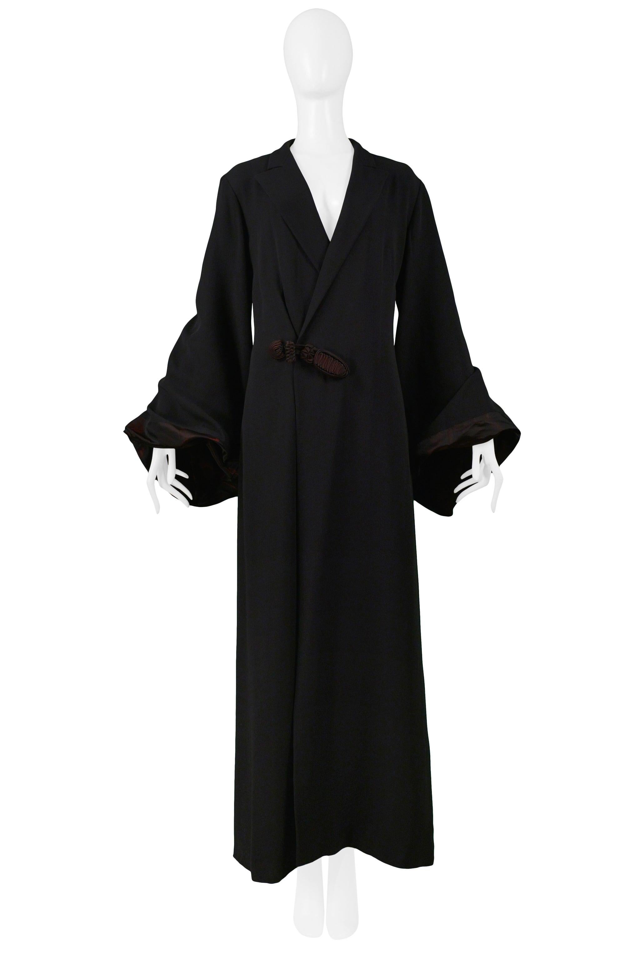 Resurrection Vintage is excited to offer a vintage Jean Paul Gaultier long black kimono robe with front frog closure, taffeta-lined twisted bell sleeves, and burgundy taffeta lining.

Jean Paul Gaultier
Size 46
Acetate; Cotton; Rayon
Excellent