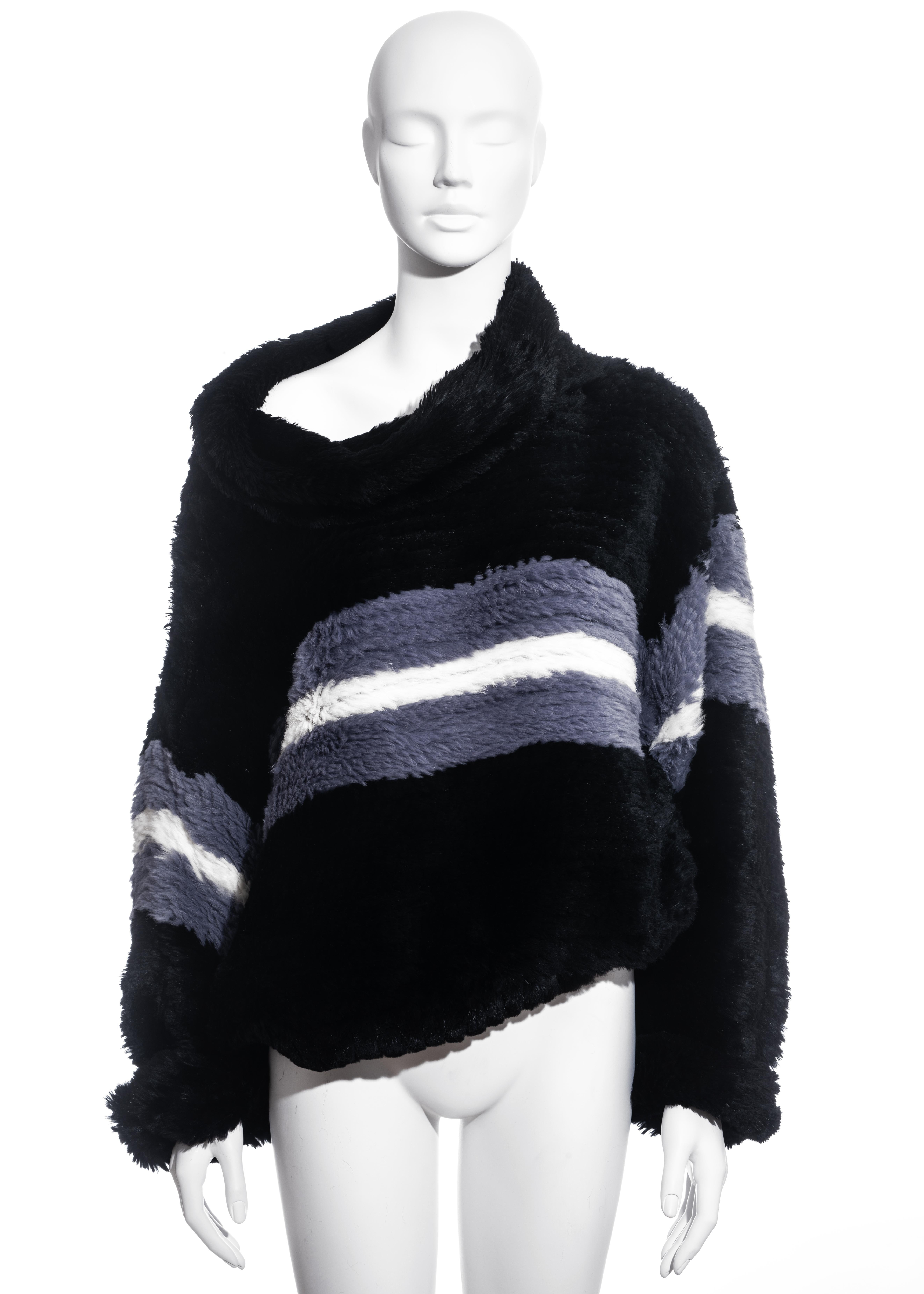 ▪ Jean Paul Gaultier black knitted fur sweater
▪ Rabbit fur
▪ White and grey striped detail
▪ Oversized fit 
▪ Wide turtle neck
▪ Size Large
▪ Fall-Winter 2003