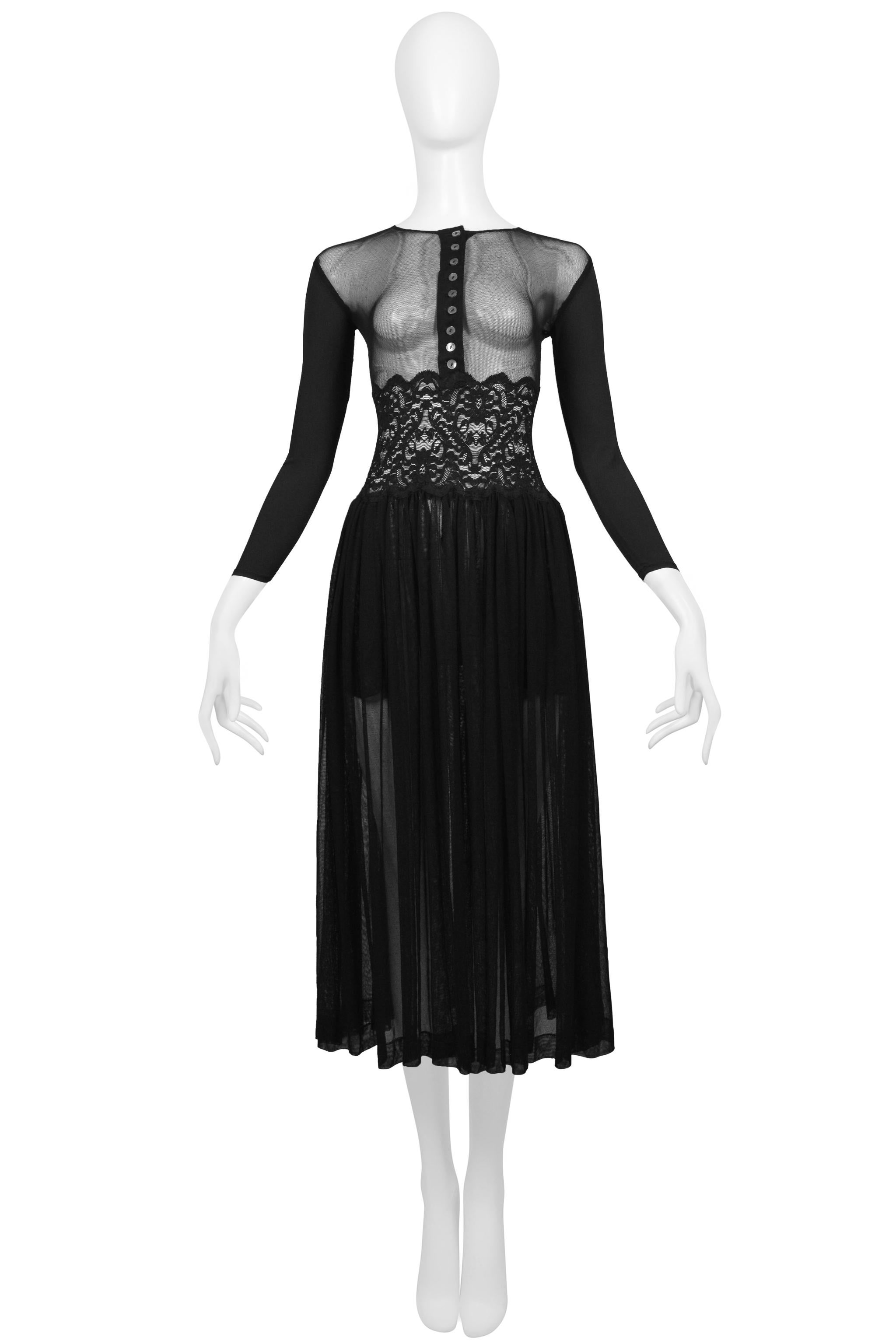 Resurrection Vintage is excited to offer a vintage Jean Paul Gaultier black mesh dress featuring solid sleeves, a sheer bodice with button front, lace waist detail, and gathered skirt.
* Jean Paul Gaultier
* Size: 40
* Fabric: 85% Lycra, 15%
